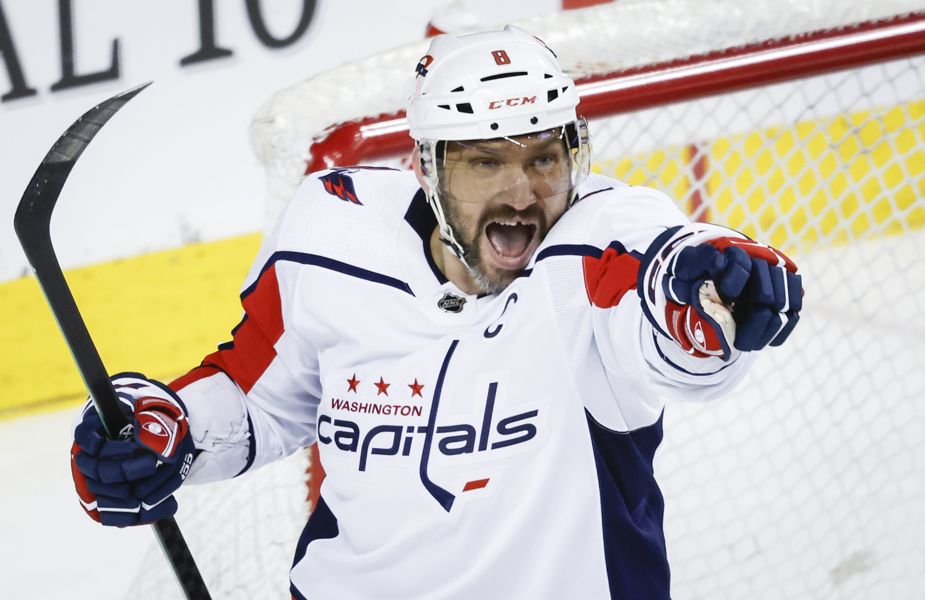 Washington Capitals forward Alex Ovechkin (8) celebrates his goal during the second period of an NHL hockey game against the Calgary Flames in Calgary, Alberta, Monday, March 18, 2024.