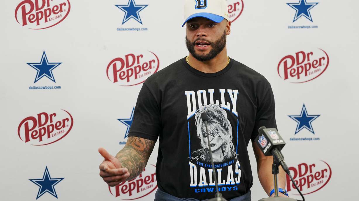 FILE - Dallas Cowboys quarterback Dak Prescott speaks during a news conference after their win against the Carolina Panthers in an NFL football game Sunday, Nov. 19, 2023, in Charlotte, N.C. The Dallas Cowboys are slightly reducing quarterback Dak Prescott's massive salary cap hit by reworking his contract going into the final year of the deal, a person with knowledge of the move said Monday, March 18, 1024.