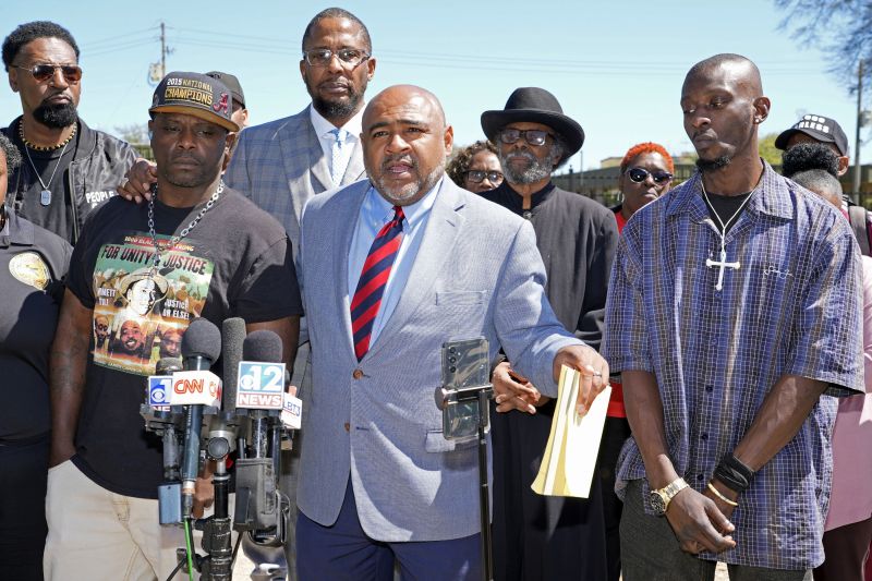 Michael Corey Jenkins, right, and Eddie Terrell Parker, left, stand with their local attorney Trent Walker, as he calls on a federal judge at a news conference Monday, in Jackson, Miss., to impose the harshest possible penalties against six former Mississippi Rankin County law enforcement officers who committed numerous acts of racially motivated, violent torture on them in 2023.