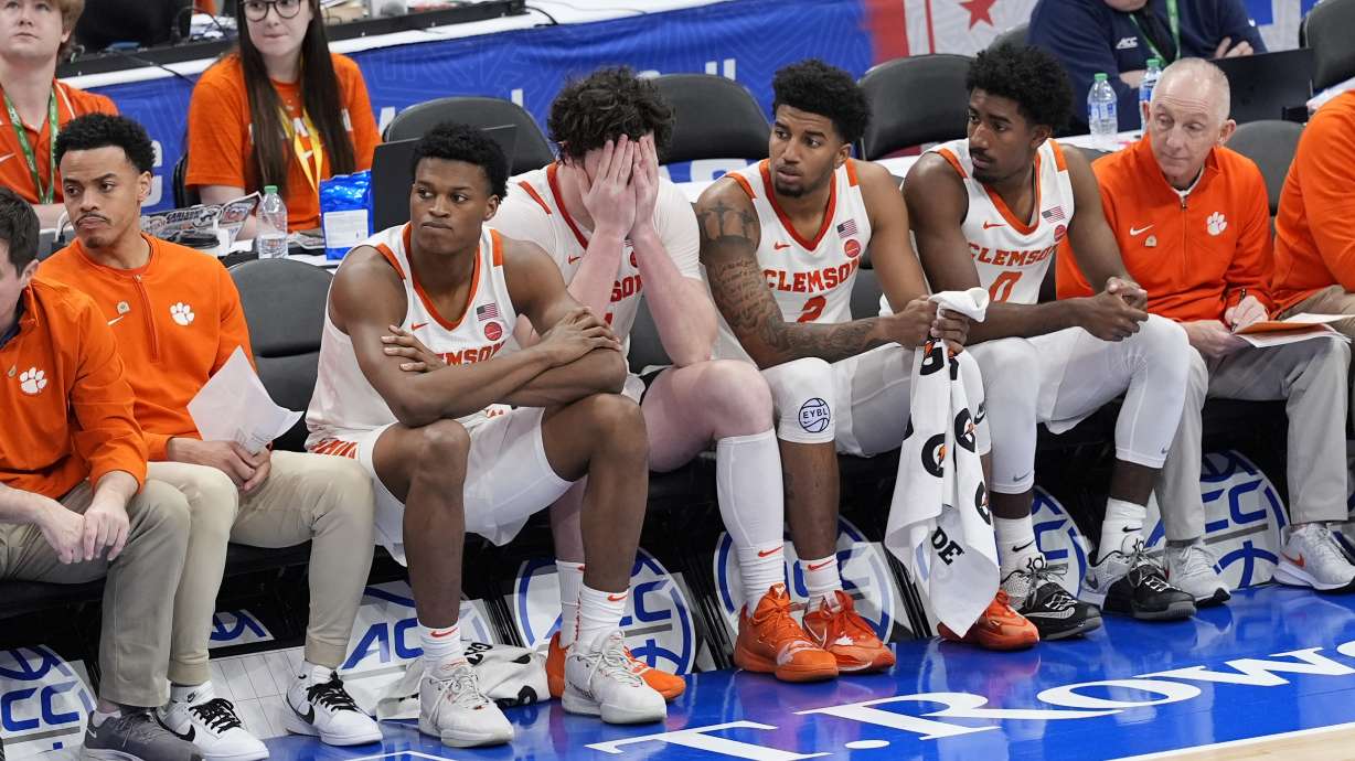 Clemson players sit on the bench near the end of the second half of the Atlantic Coast Conference NCAA college basketball tournament after their lost to Boston College, Wednesday, March 13, 2024, in Washington. Boston College won 76-55.