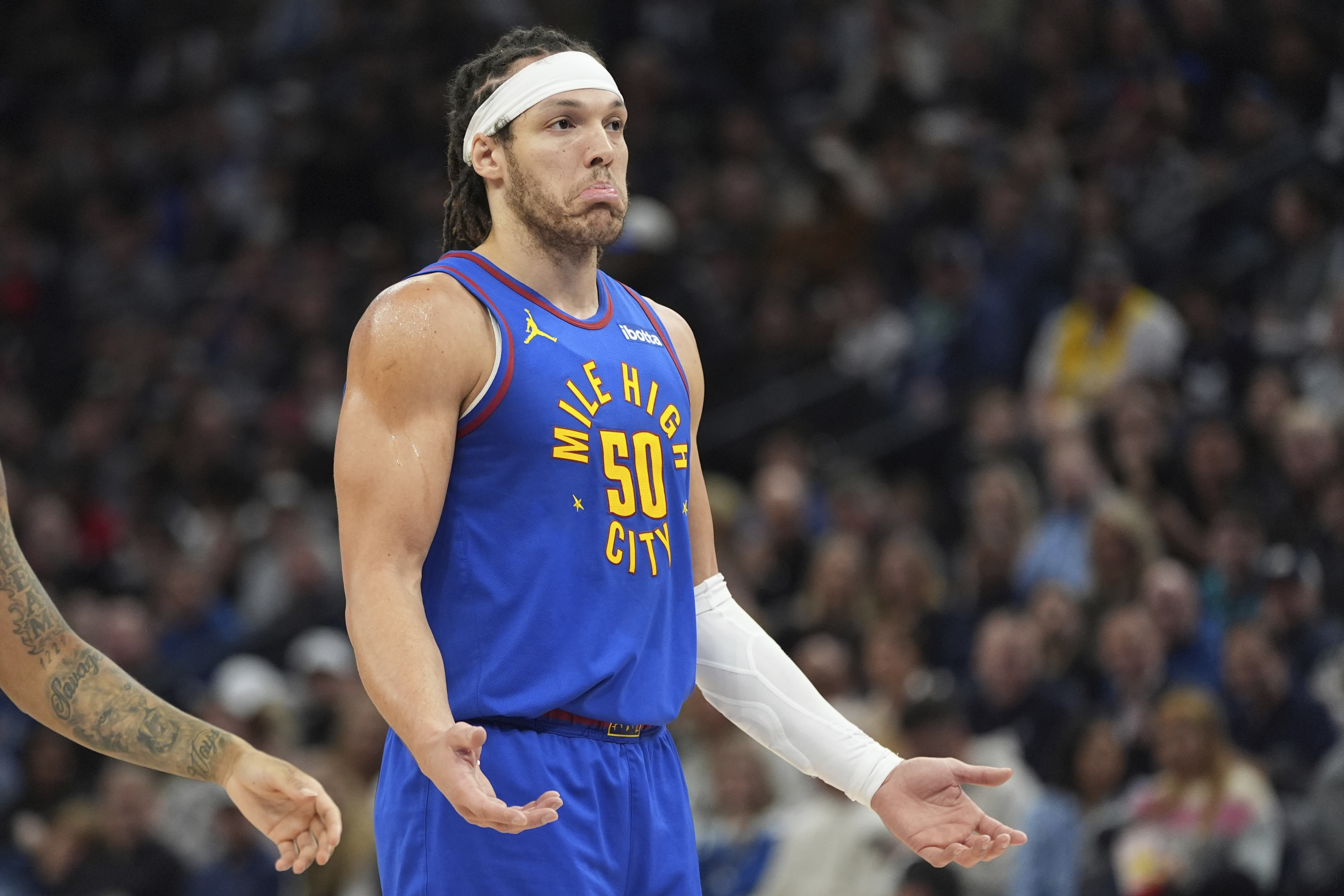 Denver Nuggets forward Aaron Gordon (50) gestures after a call by a referee during the first half of an NBA basketball game against the Minnesota Timberwolves, Tuesday, March 19, 2024, in Minneapolis.