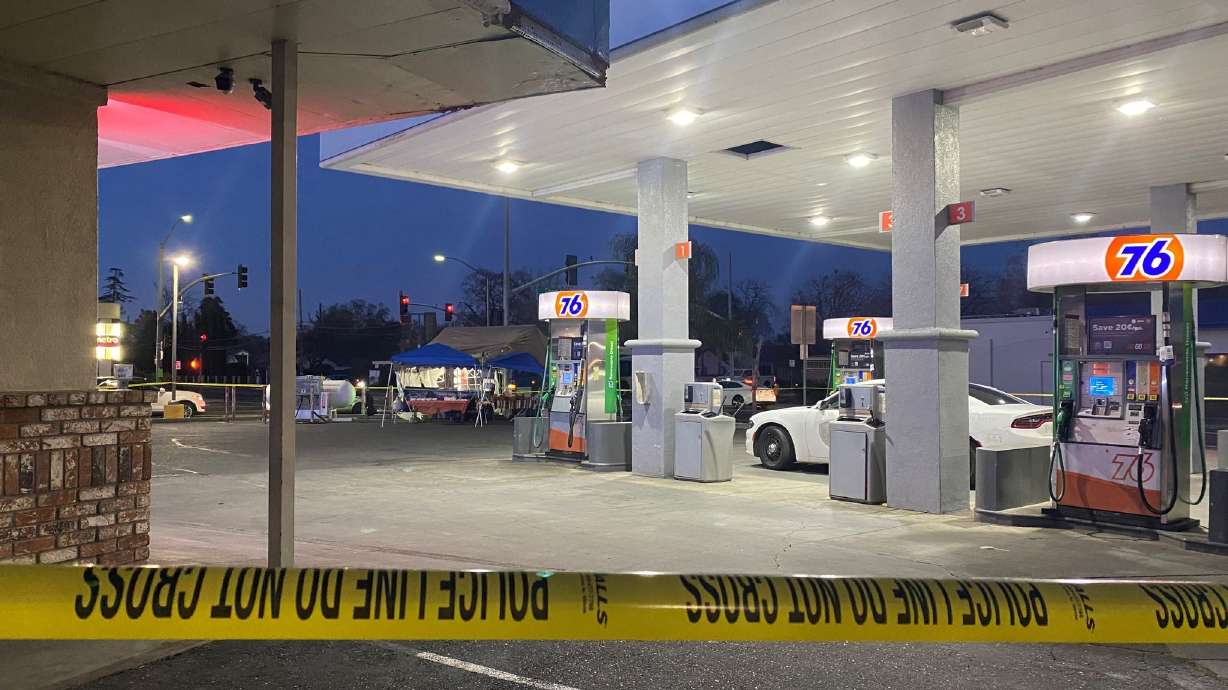 Police tape surrounds a gas station where a 2-year-old was killed in Woodland, Calif.