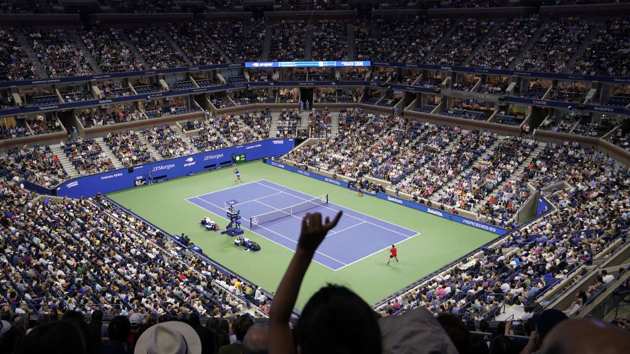 FILE - Novak Djokovic, of Serbia, left, returns against Jenson Brooksby, of the United States, play during a fourth round match at the U.S. Open tennis championships in Arthur Ashe Stadium, Monday, Sept. 6, 2021, in New York. Tennis could be on the verge of massive structural change if separate proposals formulated by the four Grand Slam tournaments and the WTA and ATP professional tours can succeed.