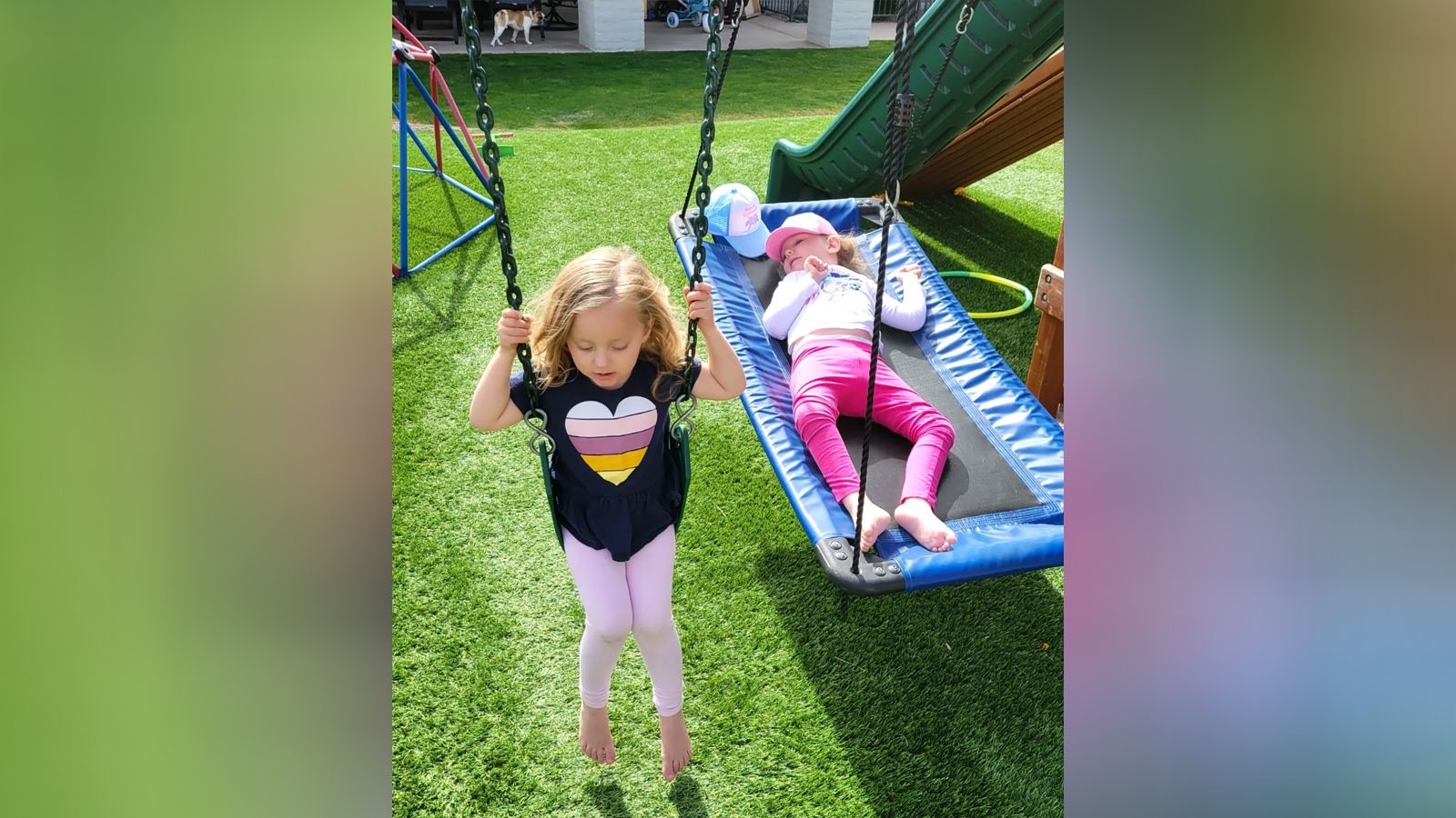 Olivia and Keira Riley are pictured at home playing in Phoenix, Arizona. Keira, age 4, was treated for a rare disease in Italy in 2020. Olivia's condition was diagnosed too late to benefit from the treatment.