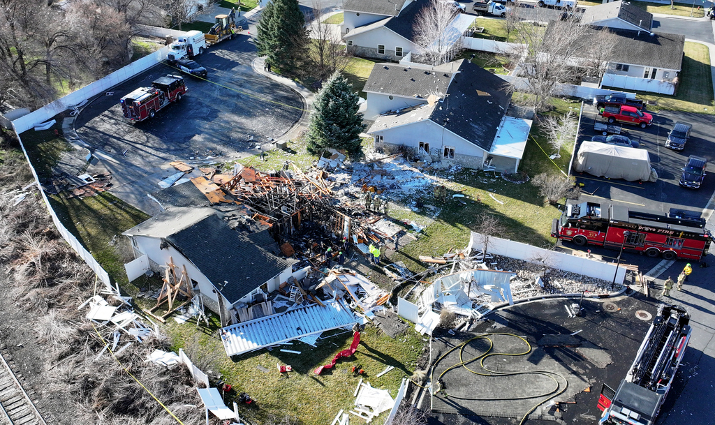 Emergency responders work at the scene of an explosion at a duplex in American Fork on Wednesday.