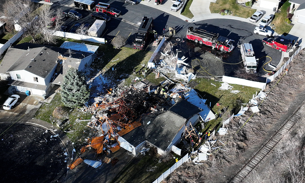 Emergency responders work at the scene of an explosion at a duplex in American Fork on March 20. One woman was found dead. American Fork released its final investigative report by the fire department on Monday.