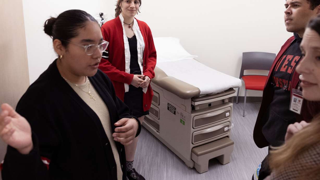 West High School seniors Monse Sipres and Keila Torres talk about the West High School Clinic in Salt Lake City on Wednesday. The new clinic will provide a wide range of services to students.