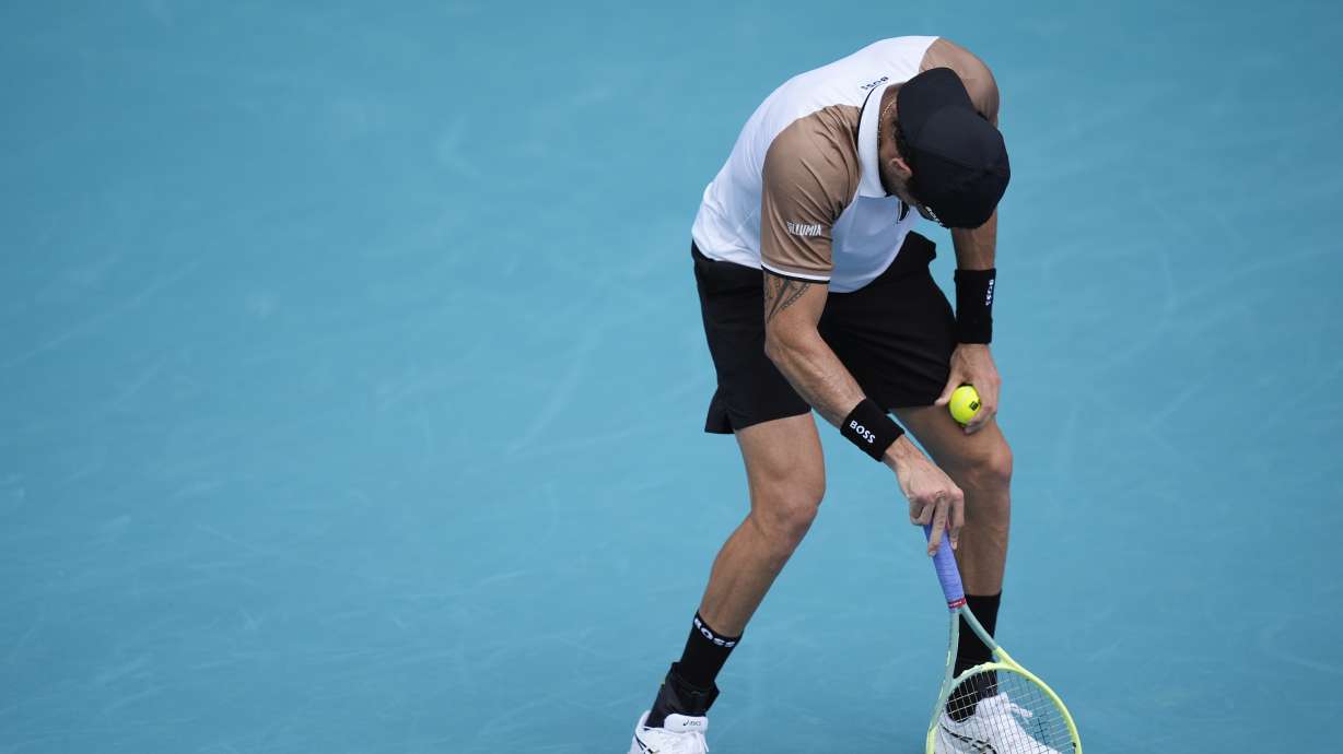 Matteo Berrettini, of Italy, stumbles and appears lightheaded, before returning to his bench mid-game to be checked by team staff, in his first round match against Andy Murray, of Britain, at the Miami Open tennis tournament, Wednesday, March 20, 2024, in Miami Gardens, Fla.