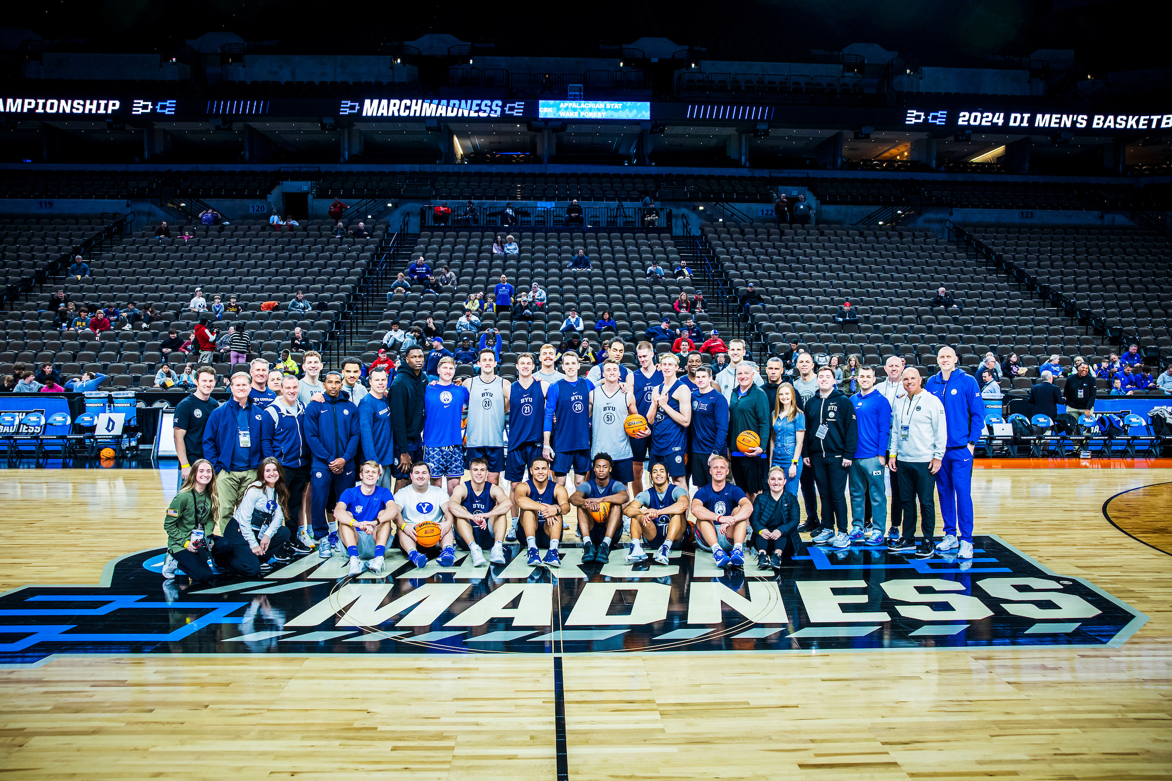 BYU basketball players, coaches and traveling staff pose for a photo at the NCAA Tournament first-round games in Omaha, Nebraska, March 20, 2024.