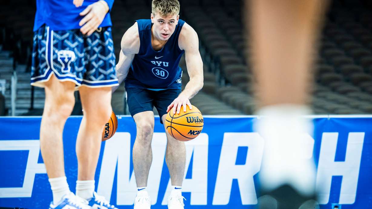 BYU point guard Dallin Hall dribbles through drills during an NCAA Tournament open practice, Wednesday, March 20, 2024 at the CHI Health Center in Omaha, Nebraska.