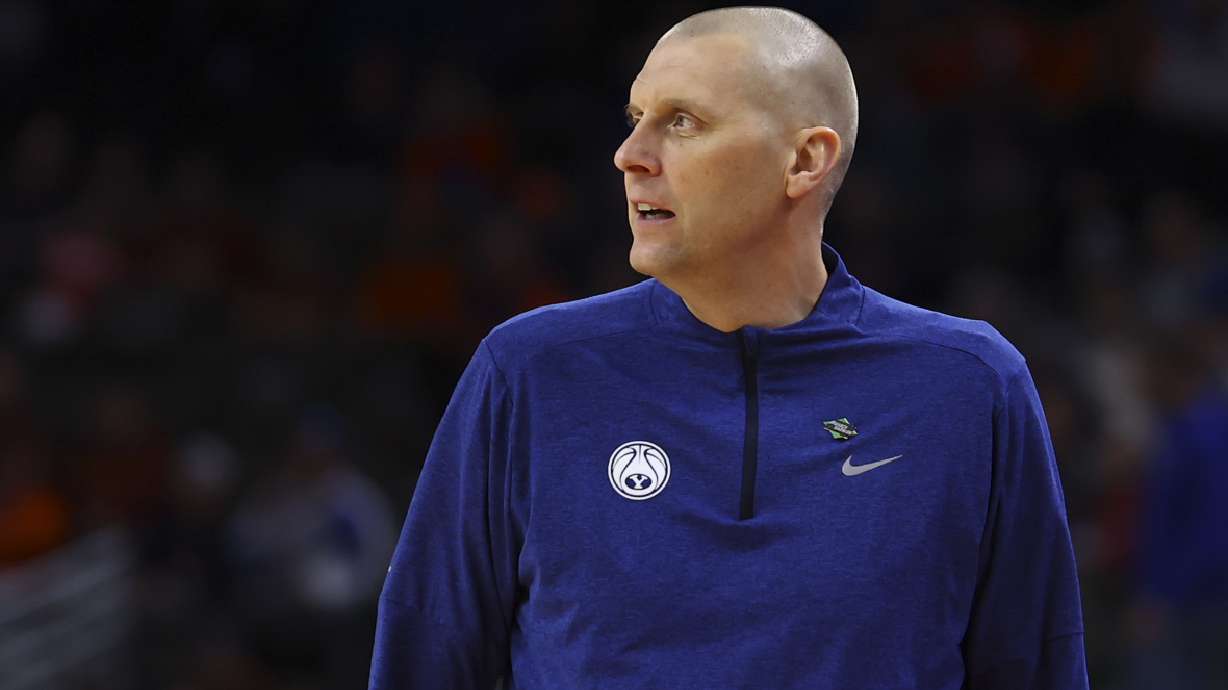 BYU head coach Mark Pope watches as his team played against Duquesne in the first half of a first-round college basketball game in the NCAA Tournament, Thursday, March 21, 2024, in Omaha, Neb.