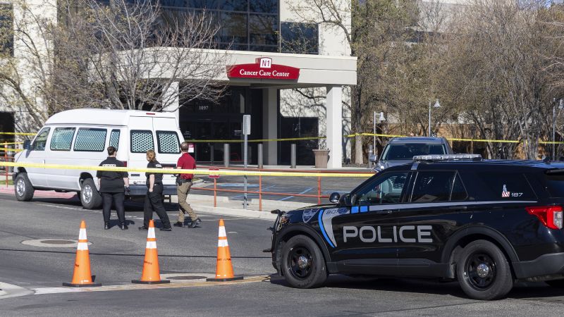 A police vehicle is parked outside Saint Alphonsus Regional Medical Center in Boise, Idaho, on Wednesday. Three Idaho corrections officers were shot as a suspect staged a brazen attack to break Skylar Meade, a prison inmate out of the Boise hospital overnight. Two of the officers were shot by the suspect early Wednesday. The third was shot and wounded by a police officer when police mistook the correctional officer for the suspect.