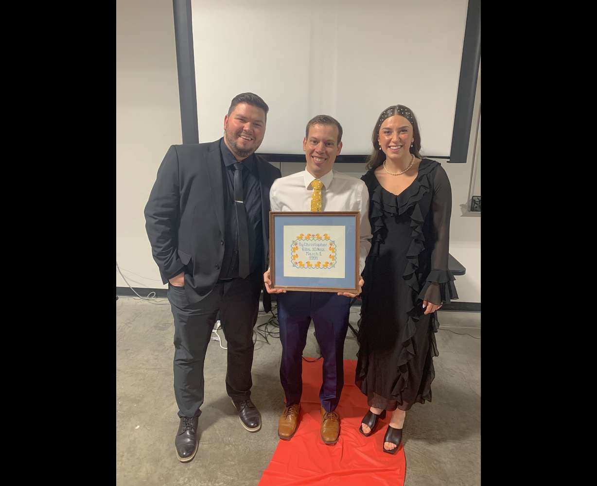 Brigham Tingey and his wife Makenna Tingey pose with Ty Nelson at a movie premiere in Orem on March 13.