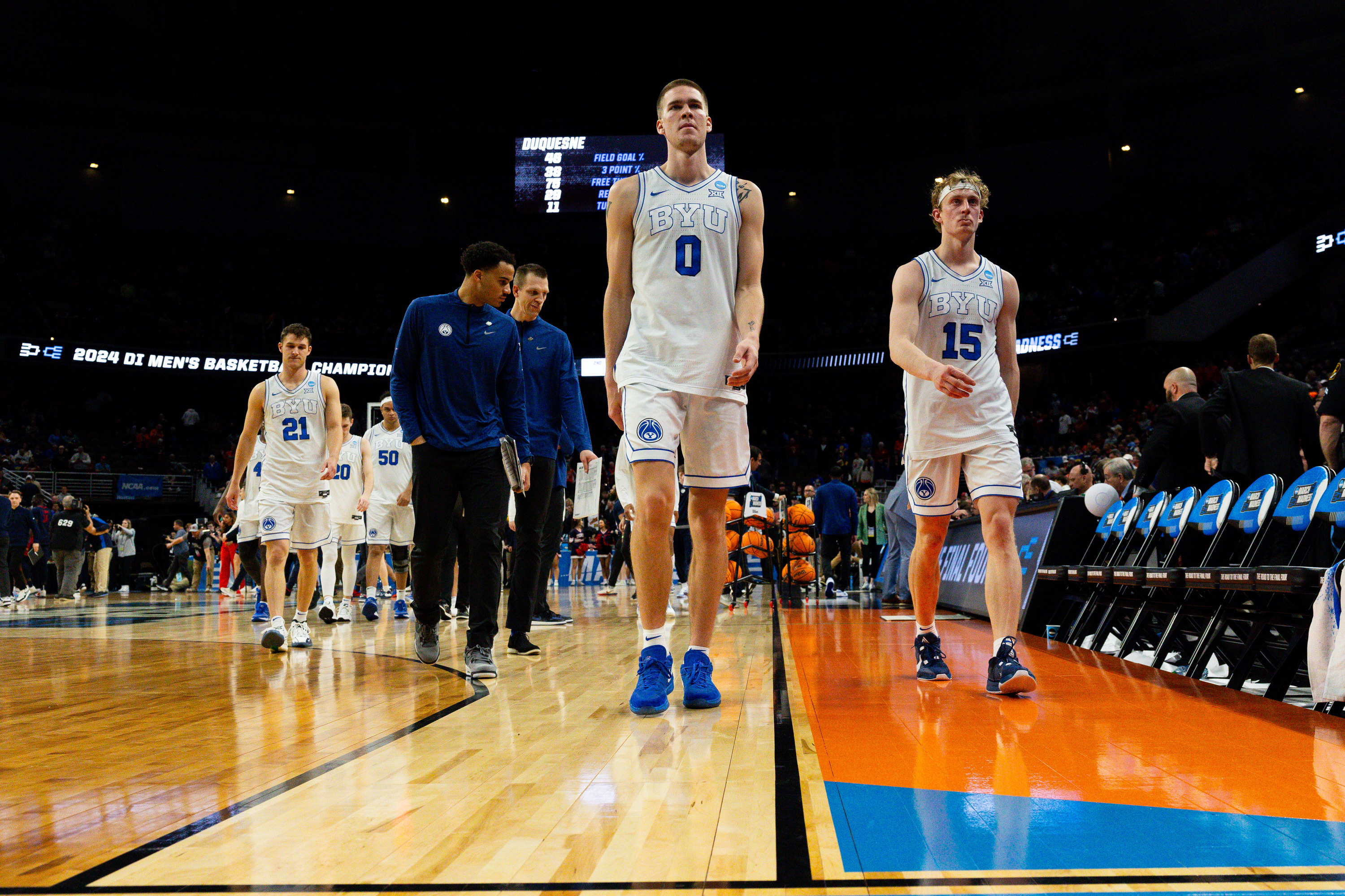 Brigham Young Cougars players walk off the court after the game between the Brigham Young Cougars and the Duquesne Dukes in the first round of the 2024 NCAA Tournament at the CHI Health Center in Omaha on Thursday, March 21, 2024. The Brigham Young Cougars lost the game 71-67.