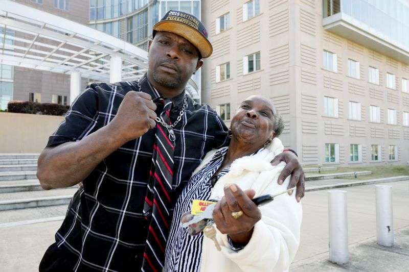 Eddie Terrell Parker and his aunt Linda Rawls express their joy at the 40-year prison sentence given to former Rankin County sheriff's deputy Christian Dedmon by a federal judge, Wednesday in Jackson, Miss. Dedmon was sentenced for his part in the racist torture of Parker and Michael Corey Jenkins by a group of white officers who called themselves the “Goon Squad.”