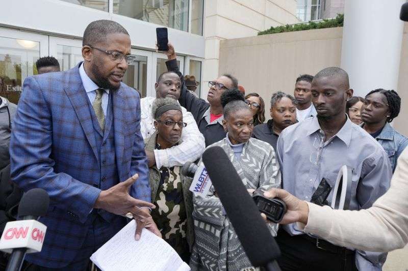 Civil co-counsel Malik Shabazz, left, speaks with reporters, accompanied by Eddie Terrell Parker and his aunt Linda Rawls, second from left, Mary Jenkins and her son Michael Corey Jenkins, outside the federal courthouse in Jackson, Miss., Thursday, following the sentencing of former Rankin County deputy Brett McAlpin to more than 27 years in federal prison for his role in the racially motivated, violent torture of Parker and Jenkins last year.