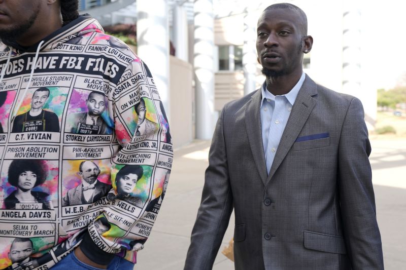 Michael Corey Jenkins, right, follows a friend as he enters the Thad Cochran United States Courthouse in Jackson, Miss., Wednesday for sentencing on the third of the six former Mississippi Rankin County law enforcement officers who committed numerous acts of racially motivated, violent torture on him and his friend Eddie Terrell Parker in 2023.