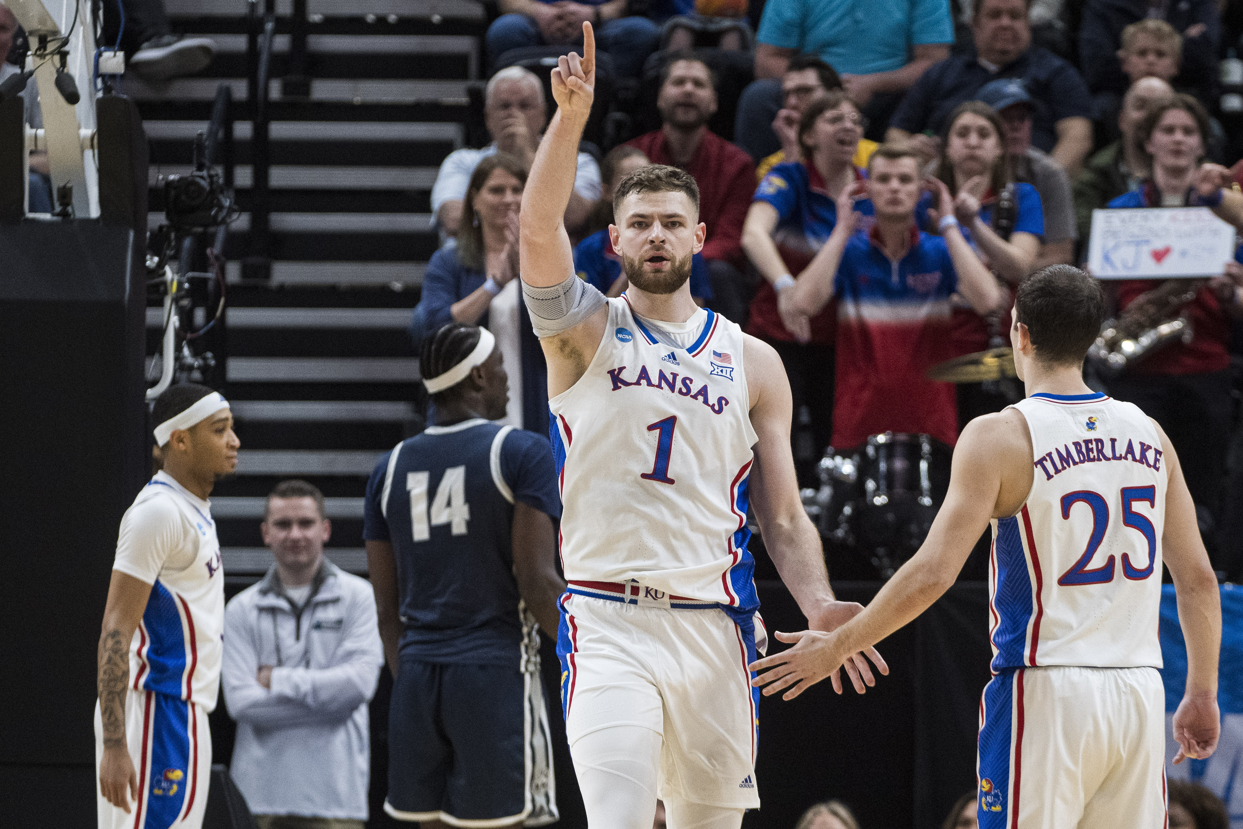 Kansas center Hunter Dickinson (1) celebrates after a play with Kansas guard Nicolas Timberlake (25) during the first half of a first-round college basketball game against Samford in the NCAA Tournament in Salt Lake City, Thursday, March 21, 2024.