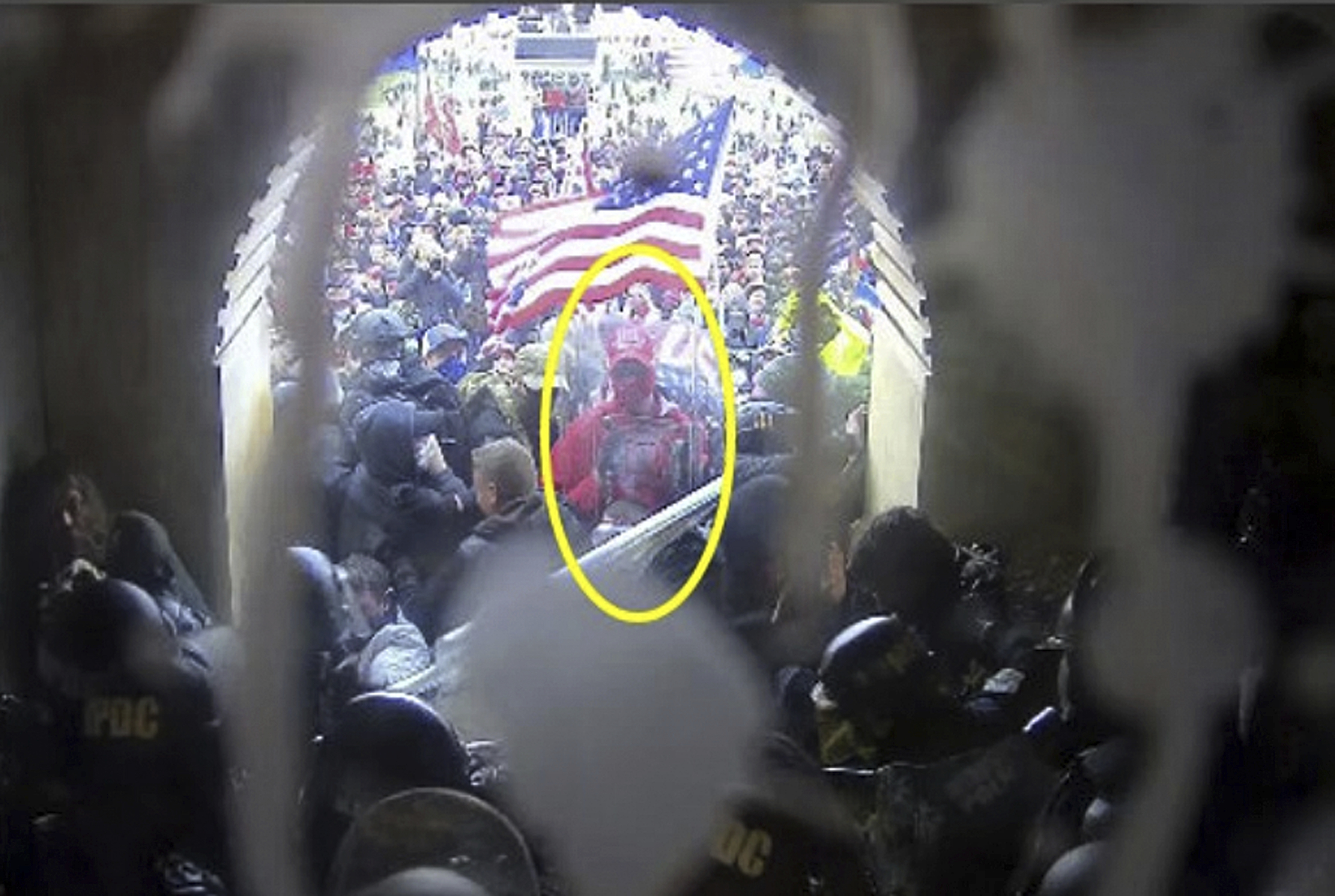 This image from police body-worn video and contained in the Justice Department statement of facts supporting the arrest of Rally Runner, shows Rally Runner outside the U.S. Capitol on Jan. 6, 2021, in Washington. Rally Runner, who legally changed his name from Daniel Donnelly Jr., pleaded guilty on Friday, March 22, 2024, to a felony charge of civil disorder and is scheduled to be sentenced in July. 