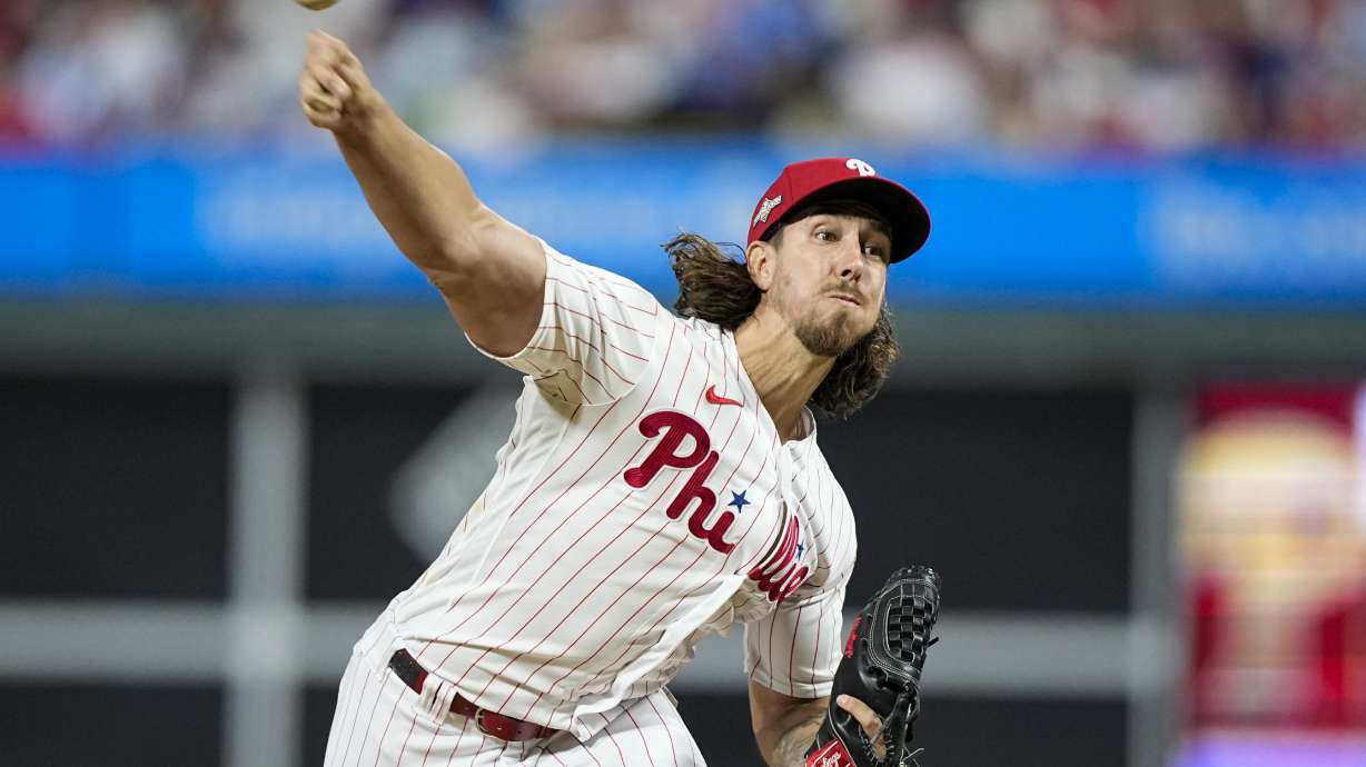 FILE - Philadelphia Phillies starting pitcher Michael Lorenzen throws against the Arizona Diamondbacks during the fifth inning in Game 6 of the baseball NL Championship Series in Philadelphia Monday, Oct. 23, 2023. Lorenzen signed a one-year contract and joined the Texas Rangers on Friday, March 22, 2024, giving the World Series champions another starting pitcher less than a week before the season opener.