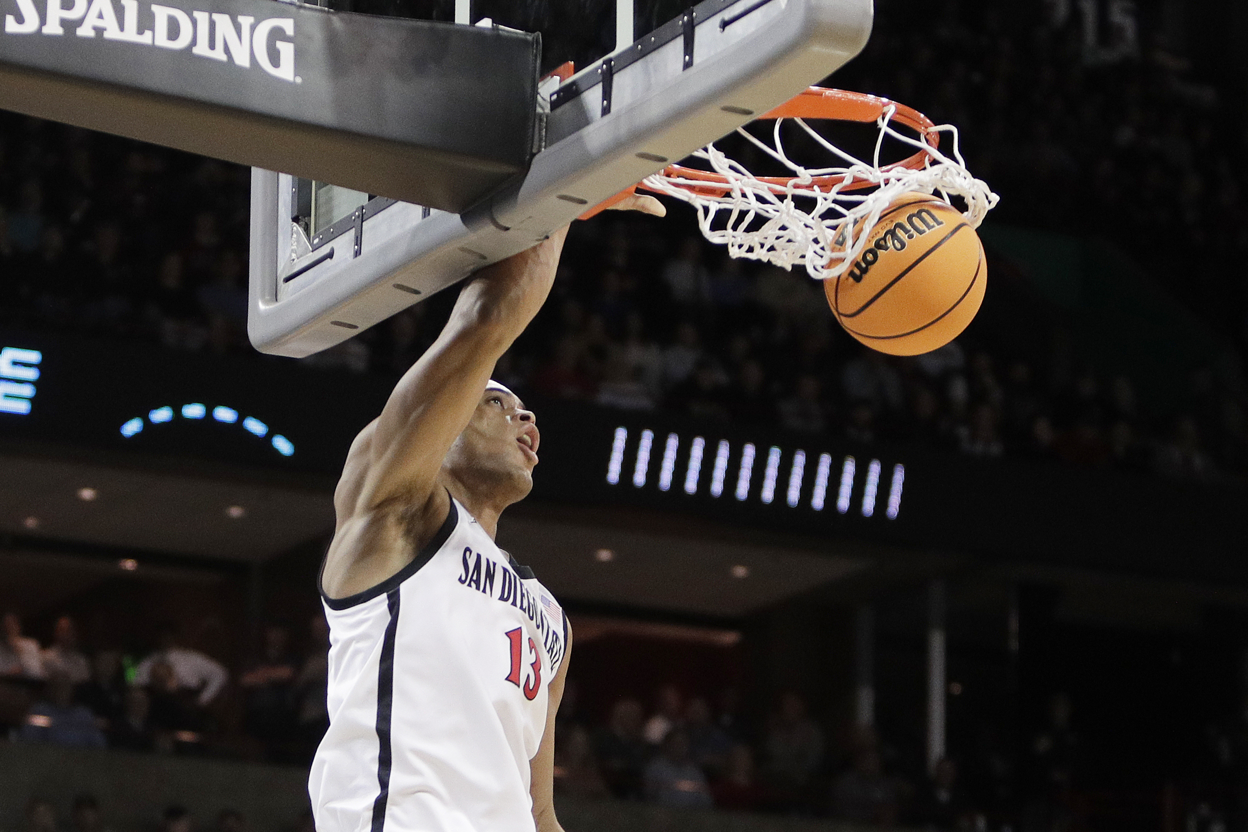San Diego State forward Jaedon LeDee (13) dunks during the first half of a first-round college basketball game in the NCAA Tournament against UAB in Spokane, Wash., Friday, March 22, 2024. 