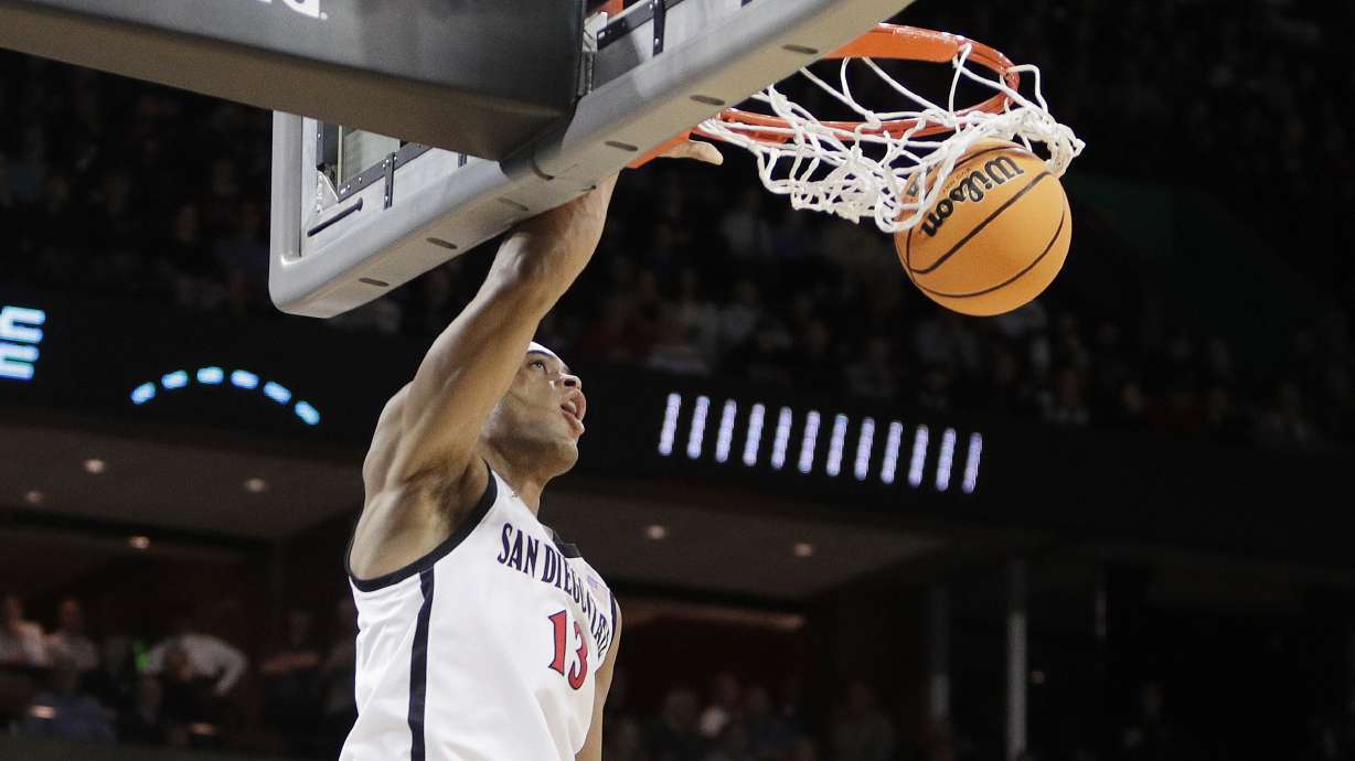 San Diego State forward Jaedon LeDee (13) dunks during the first half of a first-round college basketball game in the NCAA Tournament against UAB in Spokane, Wash., Friday, March 22, 2024.