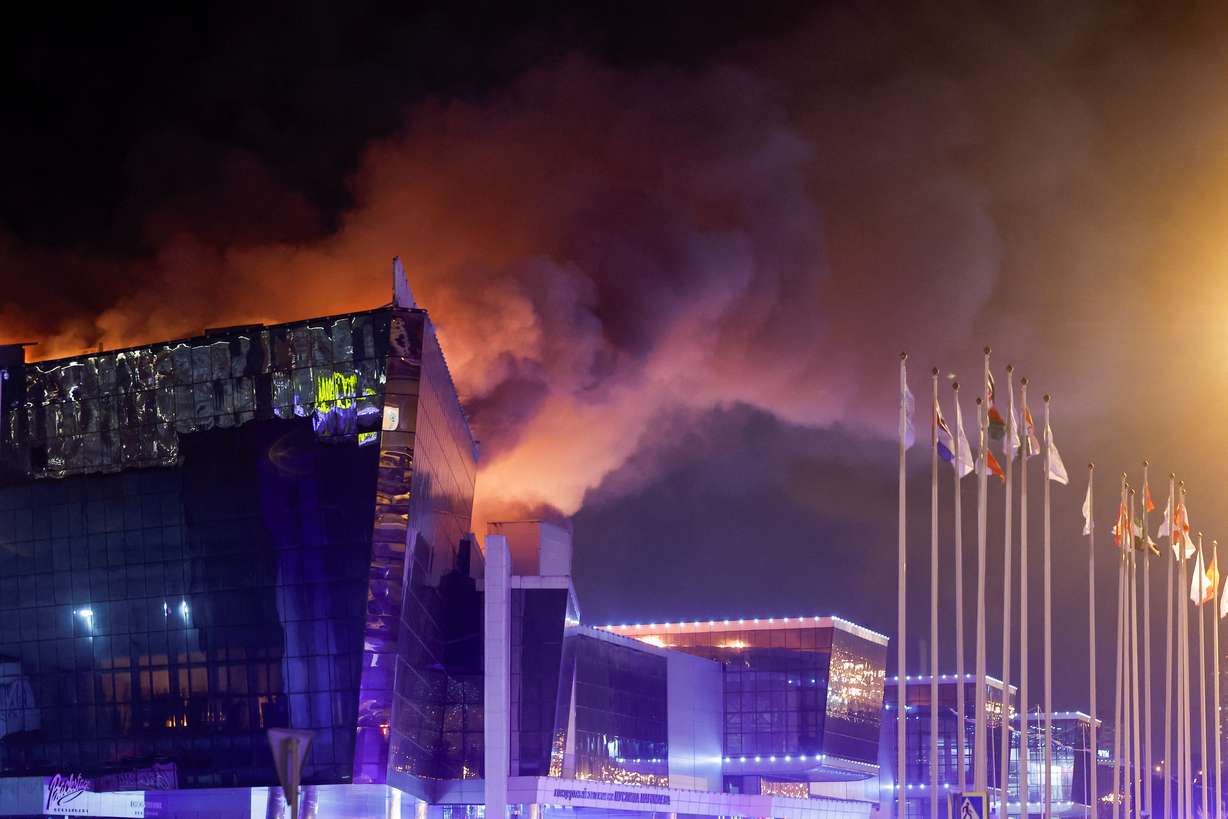 Smoke rises above the burning Crocus City Hall concert venue following a reported shooting incident, outside Moscow, Russia, Friday.