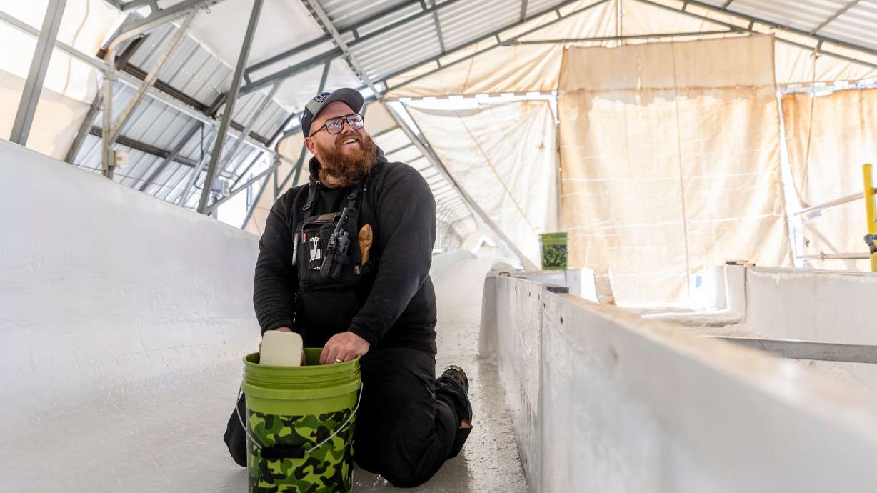 Ryan Krusi pauses for a break while filling in grooves on the track at the Utah Olympic Park in Park City on Friday. Gov. Spencer Cox is already considering the prospects of Utah becoming a permanent Olympic host.