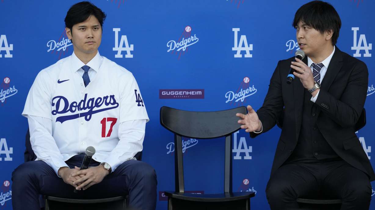 FILE - Los Angeles Dodgers' Shohei Ohtani, left, and interpreter Ippei Mizuhara answer questions during a news conference at Dodger Stadium on Dec. 14, 2023, in Los Angeles. Mizuhara has been fired from the Dodgers following allegations of illegal gambling and theft.