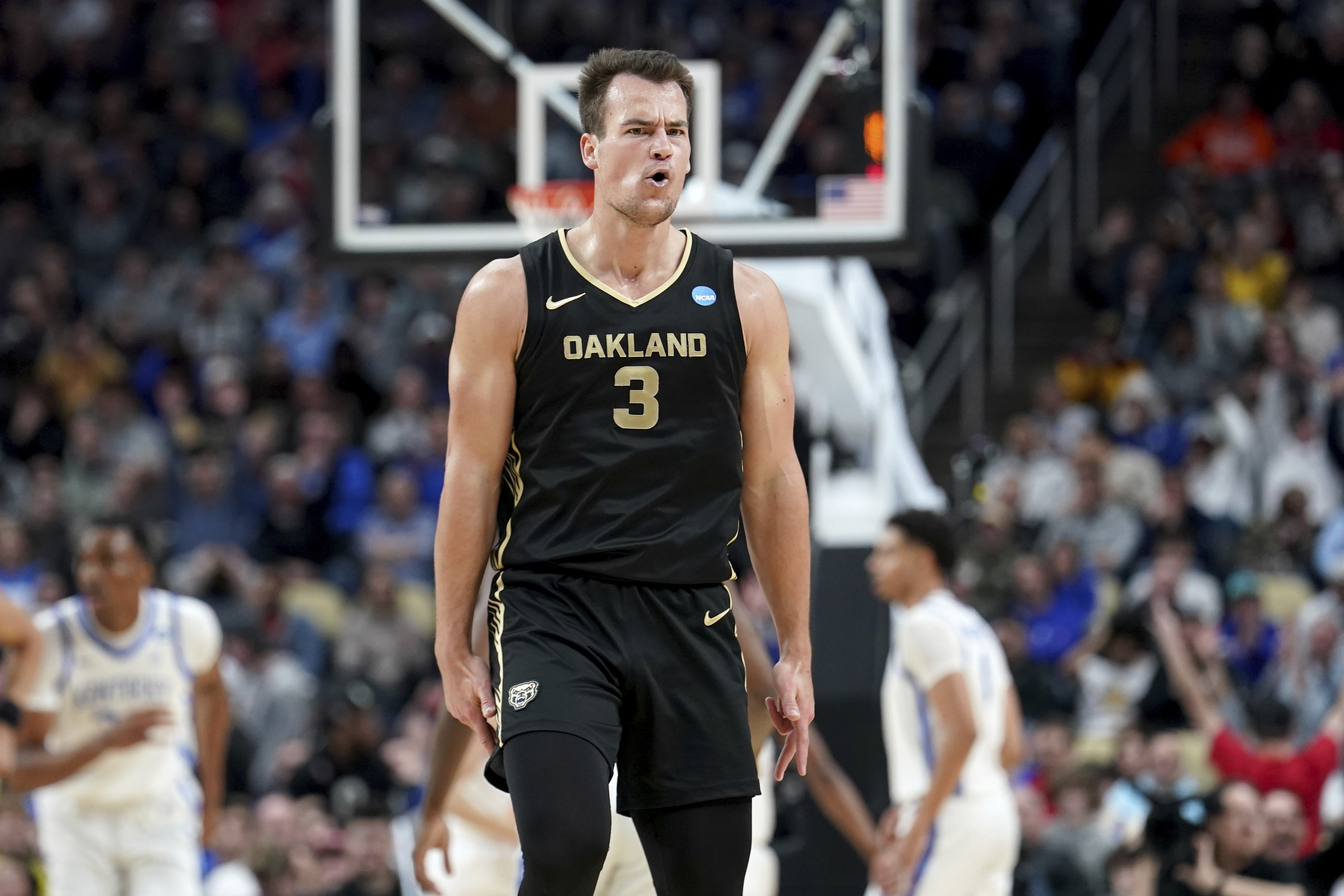 Oakland's Jack Gohlke (3) reacts after hitting a 3-point shot against Kentucky during the second half of a college basketball game in the first round of the men's NCAA tournament Thursday, March 21, 2024, in Pittsburgh.