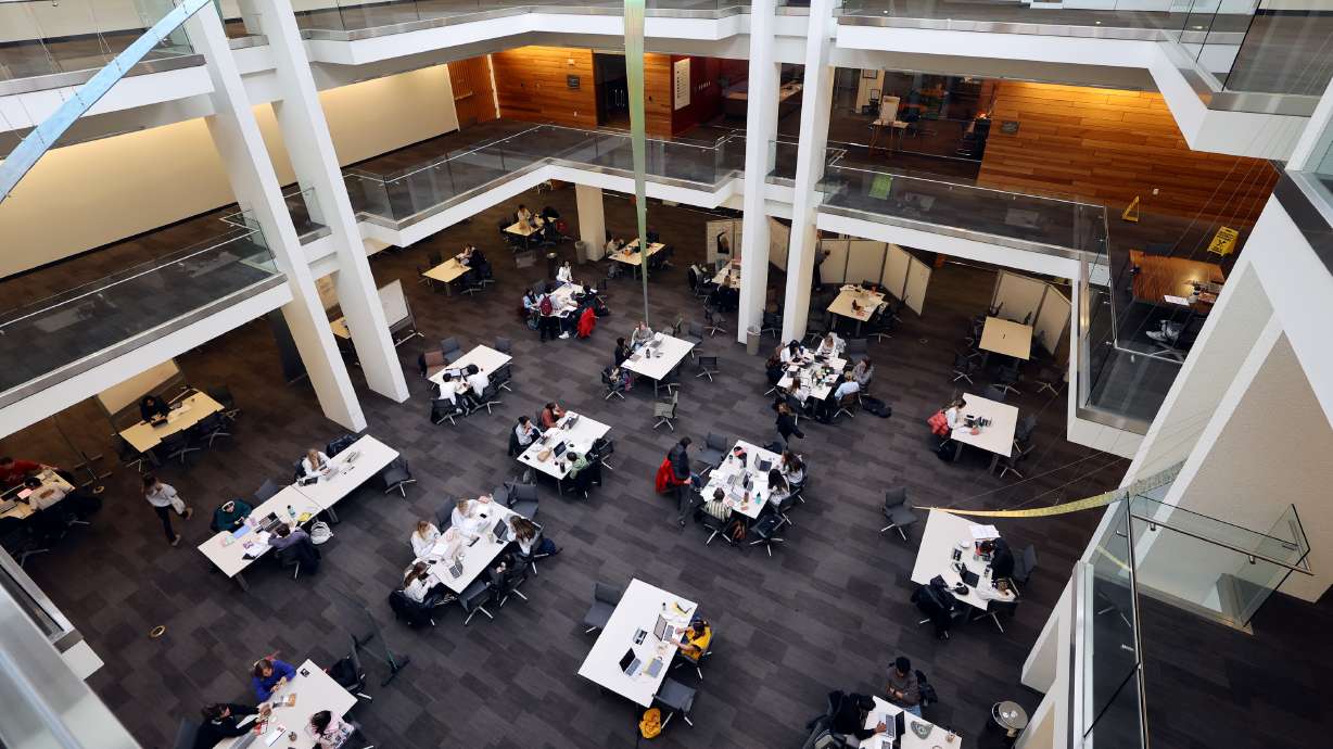 People study in the J. Willard Marriott Library at the University of Utah in Salt Lake City on Wednesday, March 13. Tuition is set to increase at eight of the Beehive State's public degree-granting institutions after the Utah System of Higher Education's governing board on Friday approved the adjustments.