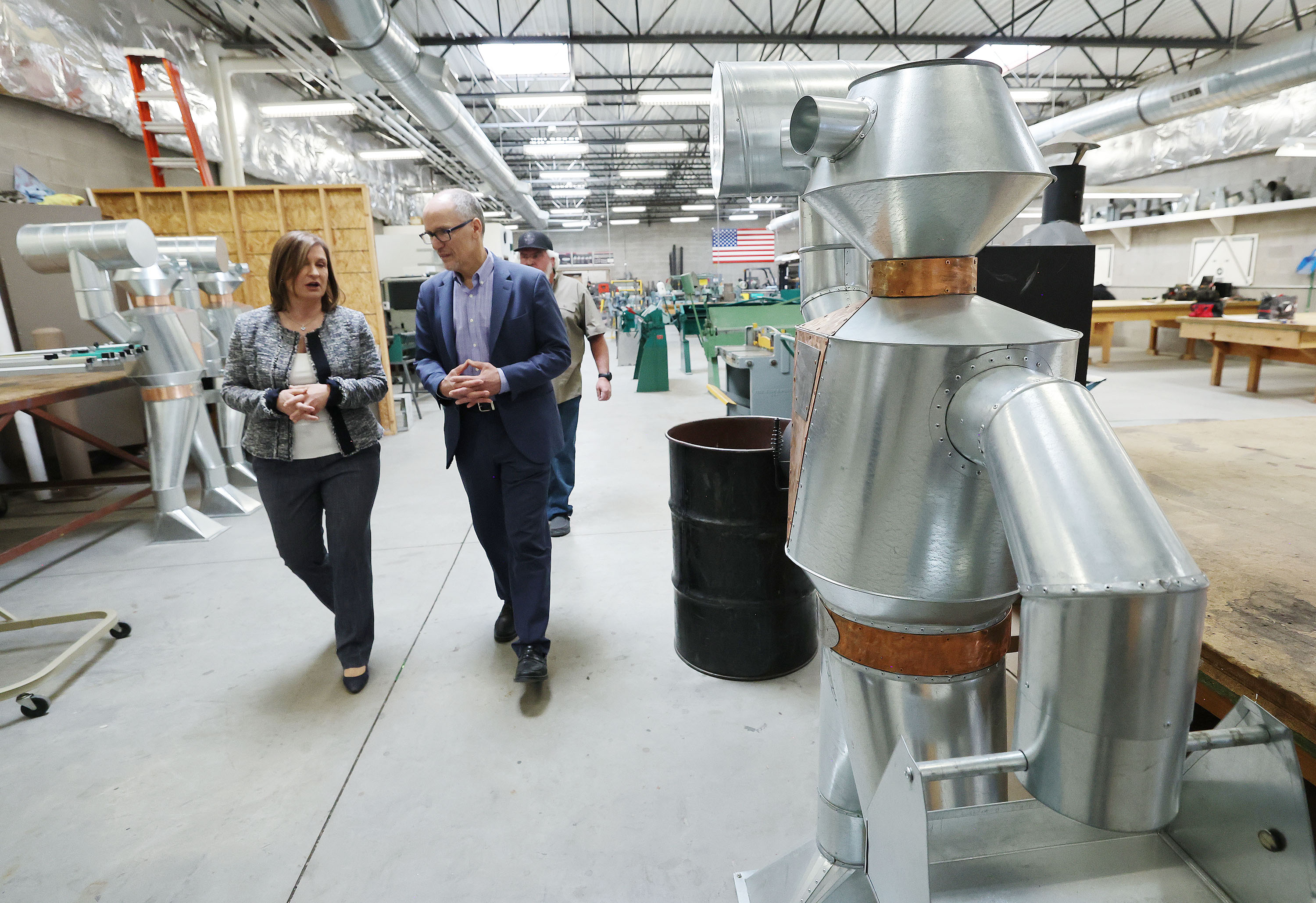Tom Perez, senior adviser to President Joe Biden and director of the White House Office of Intergovernmental Affairs, and Salt Lake County Mayor Jenny Wilson tour Utah Sheet Metal Apprenticeship Training Center in West Valley City on Friday.