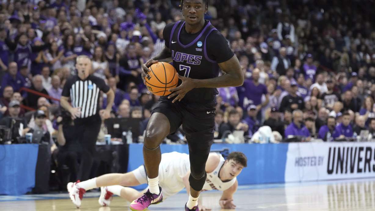 Grand Canyon guard Tyon Grant-Foster (7) dribbles the ball away from Saint Mary's guard Alex Ducas after getting possession of the ball during the first half of a first-round college basketball game in the men's NCAA Tournament in Spokane, Wash., Friday, March 22, 2024.