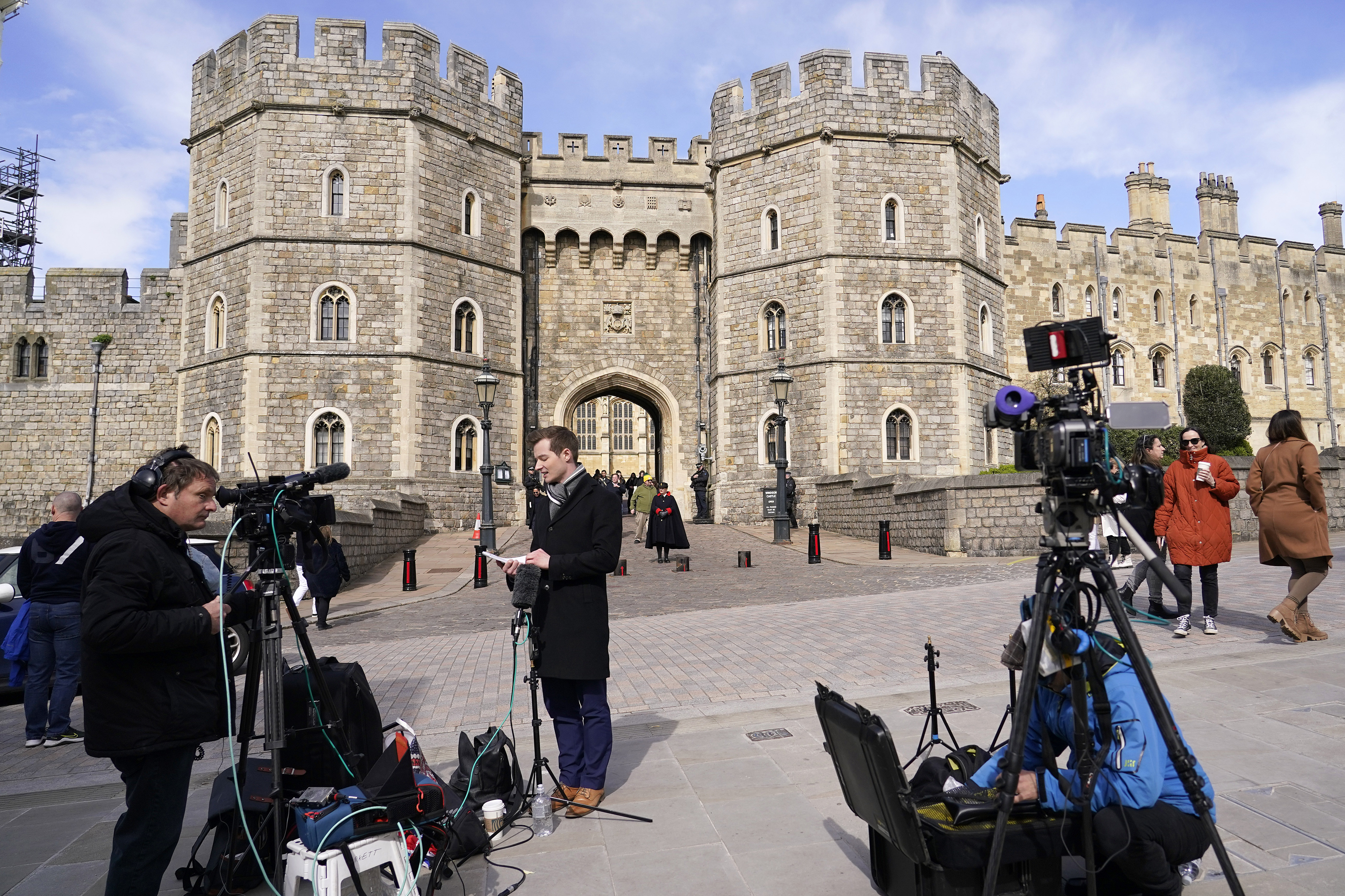 Media waits outside Windsor Castle in Windsor, England, Saturday. Britain's Kate, Princess of Wales's revelation she is undergoing treatment for cancer has sparked an outpouring of support and well wishes from around the world.