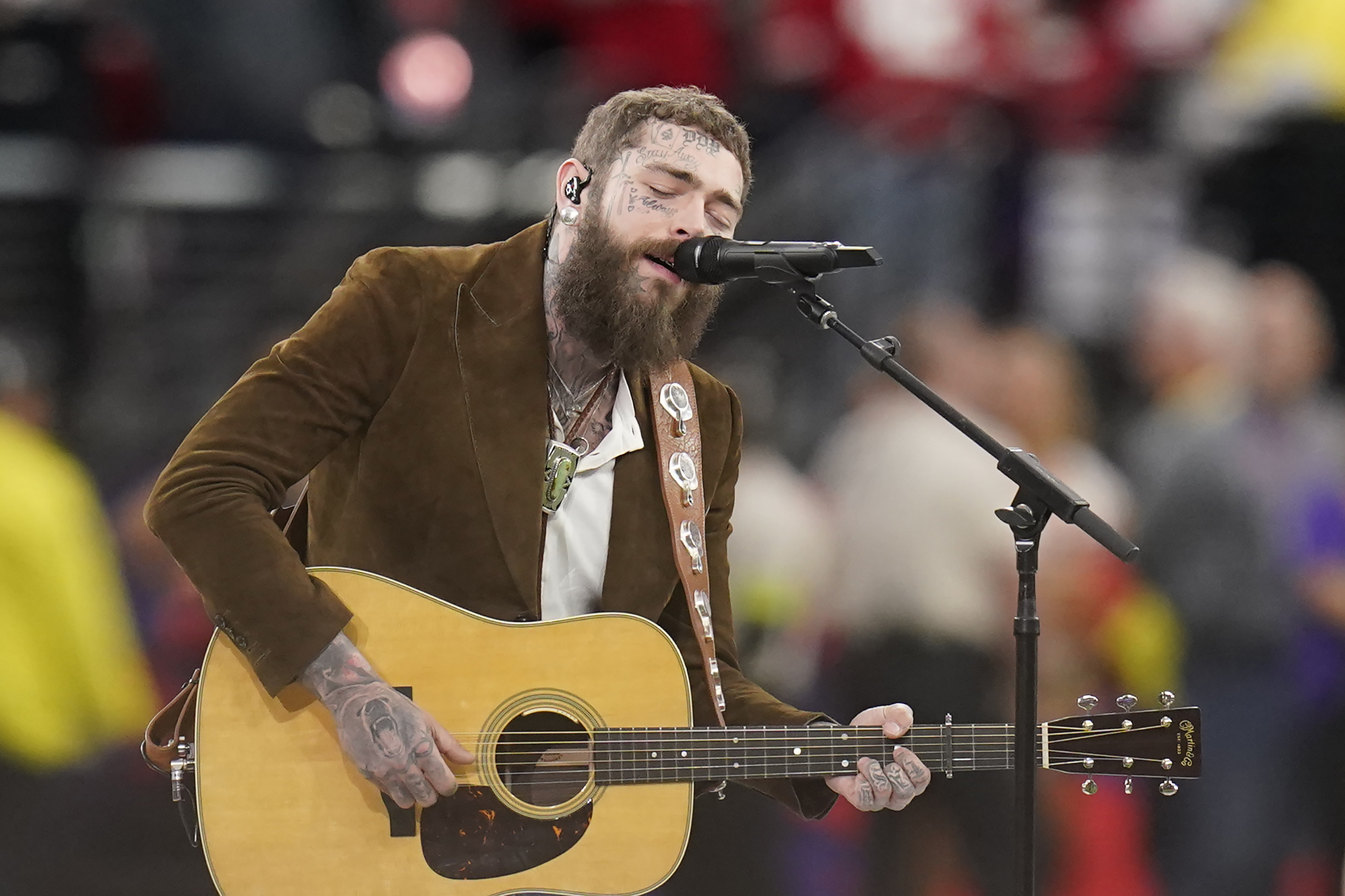 Post Malone performs "America the Beautiful" during the first half of the NFL Super Bowl 58 football game Sunday, Feb. 11, 2024, in Las Vegas. A country music album from the artist appears to be on the horizon.
