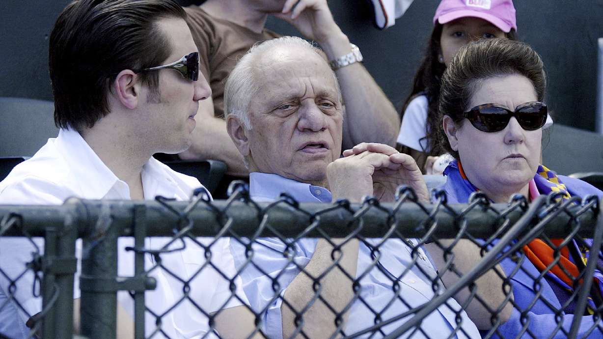 FILE - Peter G. Angelos, center, owner of the Baltimore Orioles, sits in the owners box at Ft.Lauderdale Stadium in Ft. Lauderdale, Fla. with his son, Louis, and wife, Georgia, during his team's spring training baseball game against the Boston Red Sox Sunday, March 18, 2007. Peter Angelos, owner of a Baltimore Orioles team that endured long losing stretches and shrewd proprietor of a law firm that won high-profile cases against industry titans, died Saturday, March 23, 2024. He was 94.