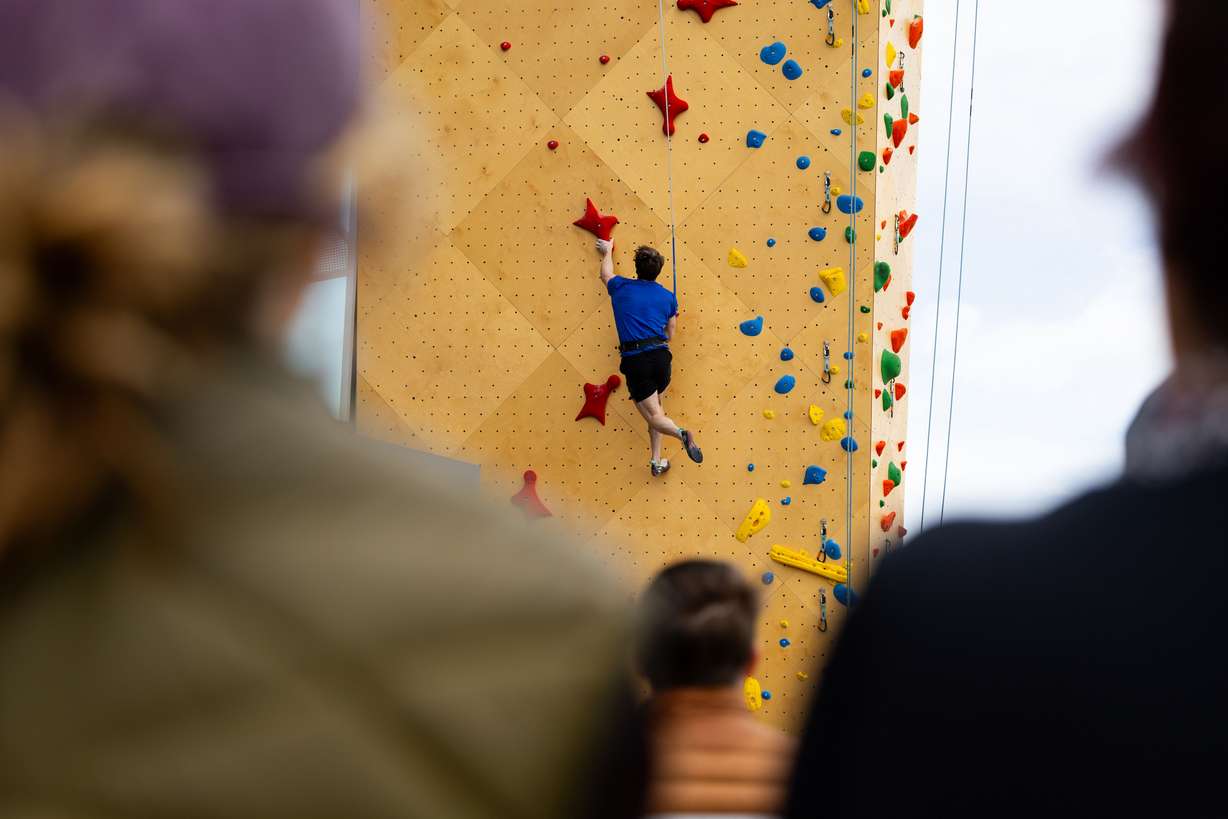 John Brosler, a professional speed climber who lives in Salt Lake City, climbs at the grand opening of an outdoor climbing wall outside Millcreek City Hall on Saturday. The climbing wall provides a unique experience for the community as the world’s first “City Hall Climbing Wall” and aims to lower the barriers of entry usually associated with climbing.