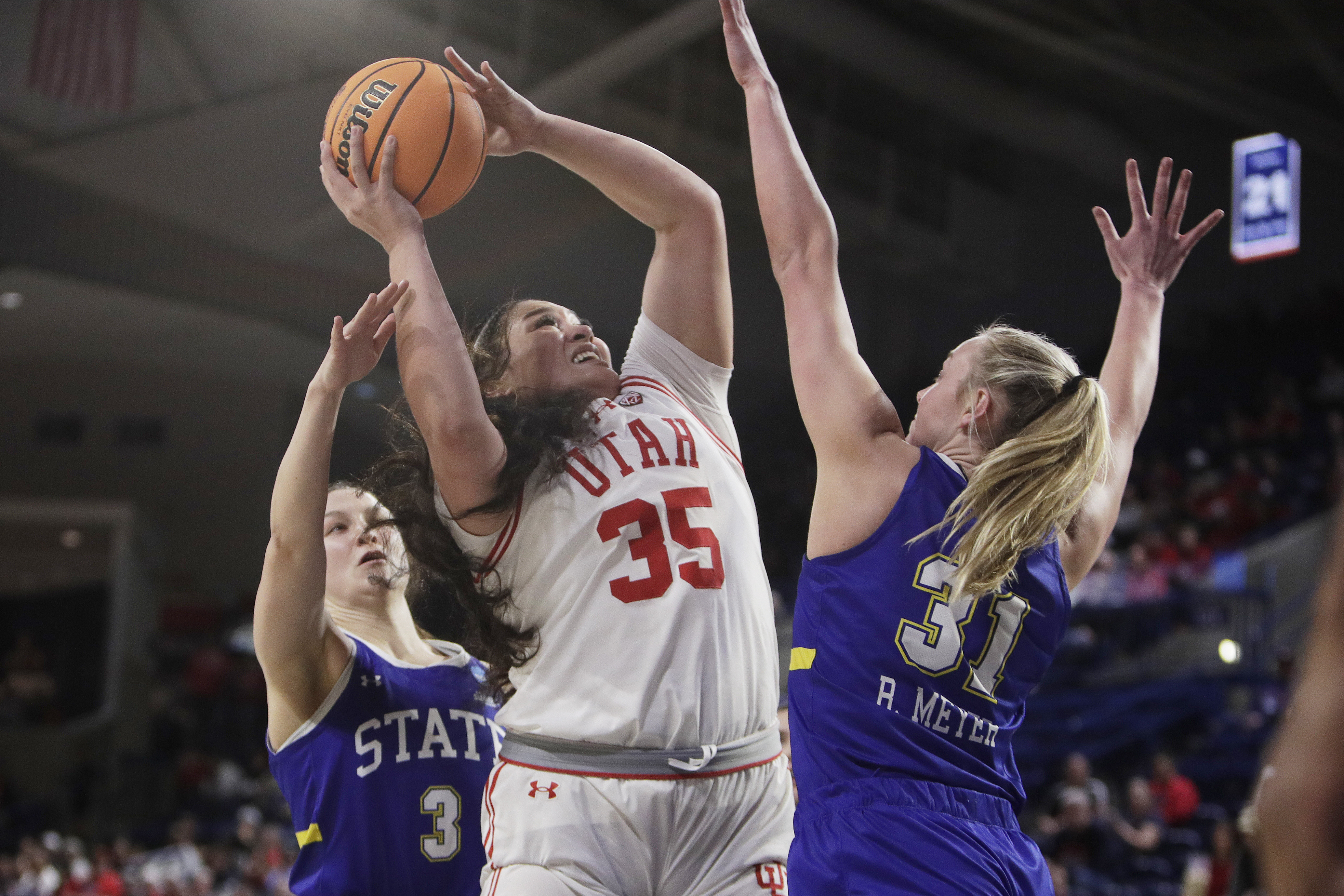 Utah forward Alissa Pili (35) shoots from between South Dakota State guard Madison Mathiowetz (3) and forward Brooklyn Meyer (31) during the first half of a first-round college basketball game in the women's NCAA Tournament in Spokane, Wash., Saturday, March 23, 2024.