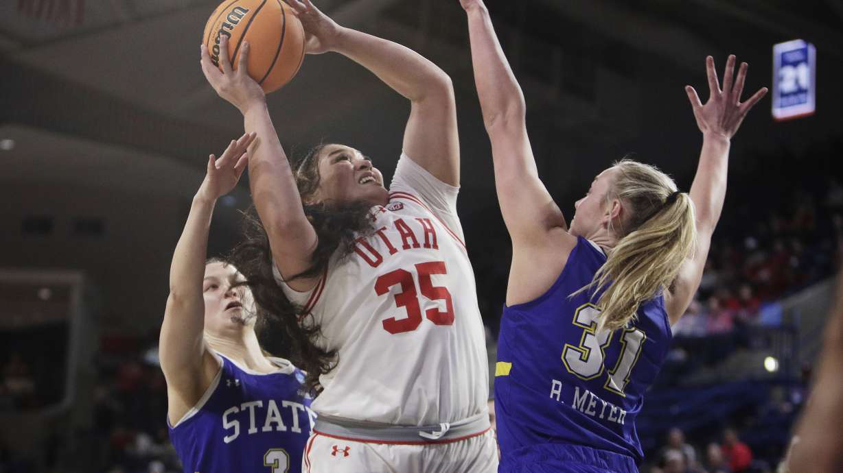 Utah forward Alissa Pili (35) shoots from between South Dakota State guard Madison Mathiowetz (3) and forward Brooklyn Meyer (31) during the first half of a first-round college basketball game in the women's NCAA Tournament in Spokane, Wash., Saturday, March 23, 2024.