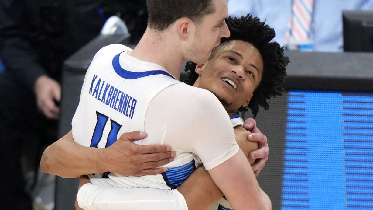Creighton's Ryan Kalkbrenner (11) celebrates with Trey Alexander after a double overtime win in a second-round college basketball game in the NCAA Tournament against Oregon in Pittsburgh, Sunday, March 24, 2024.