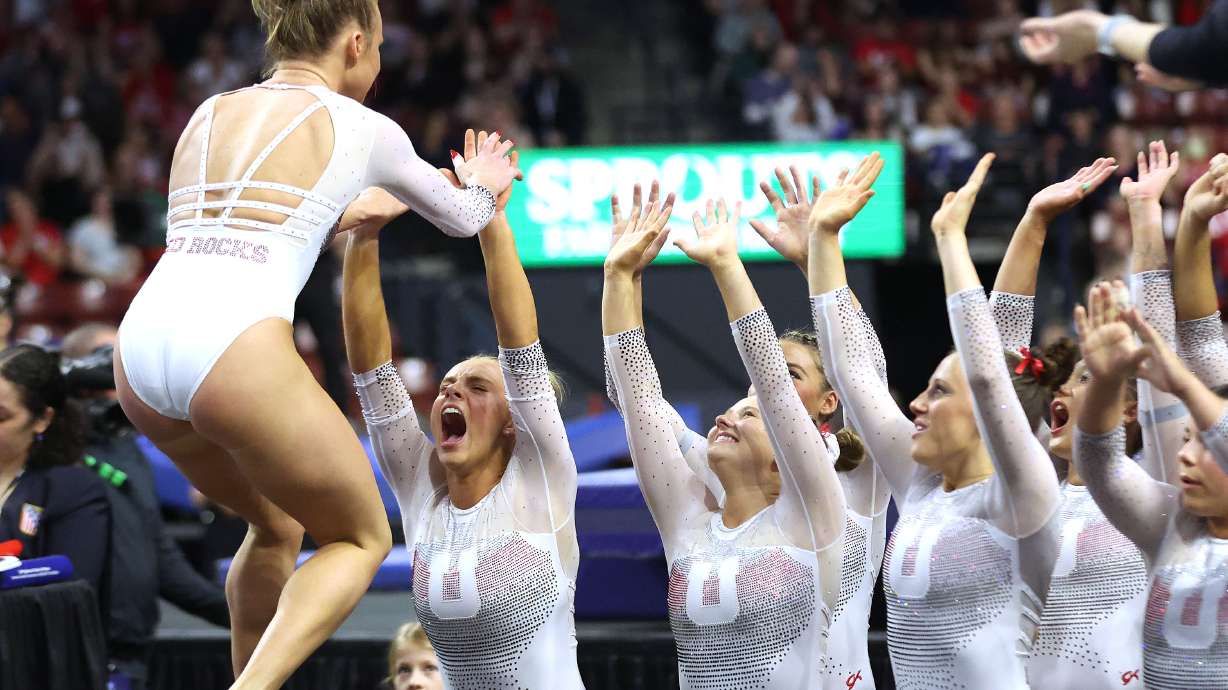 Abby Paulson celebrates her floor with teammates during the Pac-12 gymnastics championships at the Maverik Center in West Valley City on Saturday, March 23, 2024.