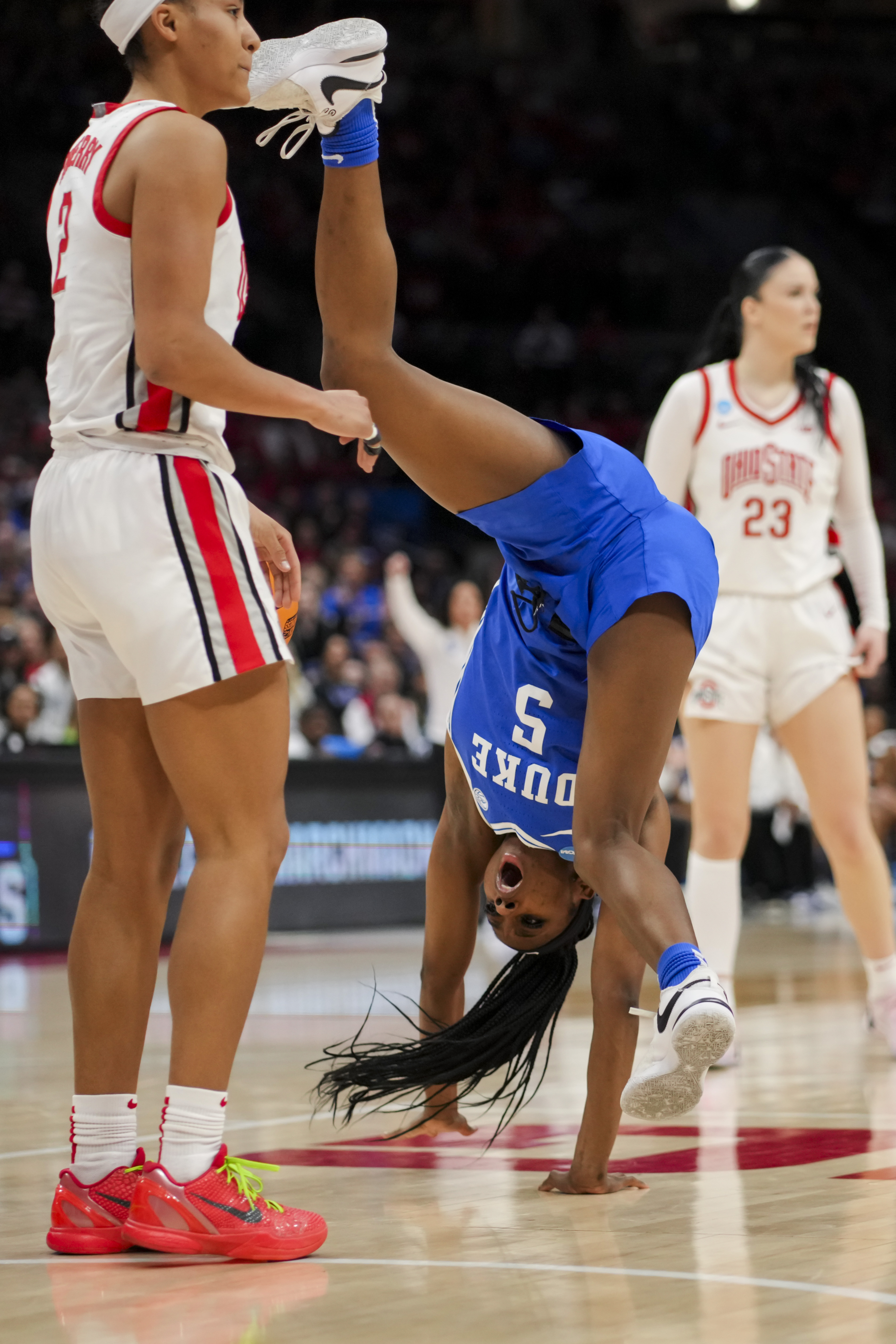 Duke guard Oluchi Okananwa, front right, tumbles after colliding with Ohio State guard Taylor Thierry, left, during the first half of a second-round college basketball game in the women's NCAA Tournament, Sunday, March 24, 2024, in Columbus, Ohio. 