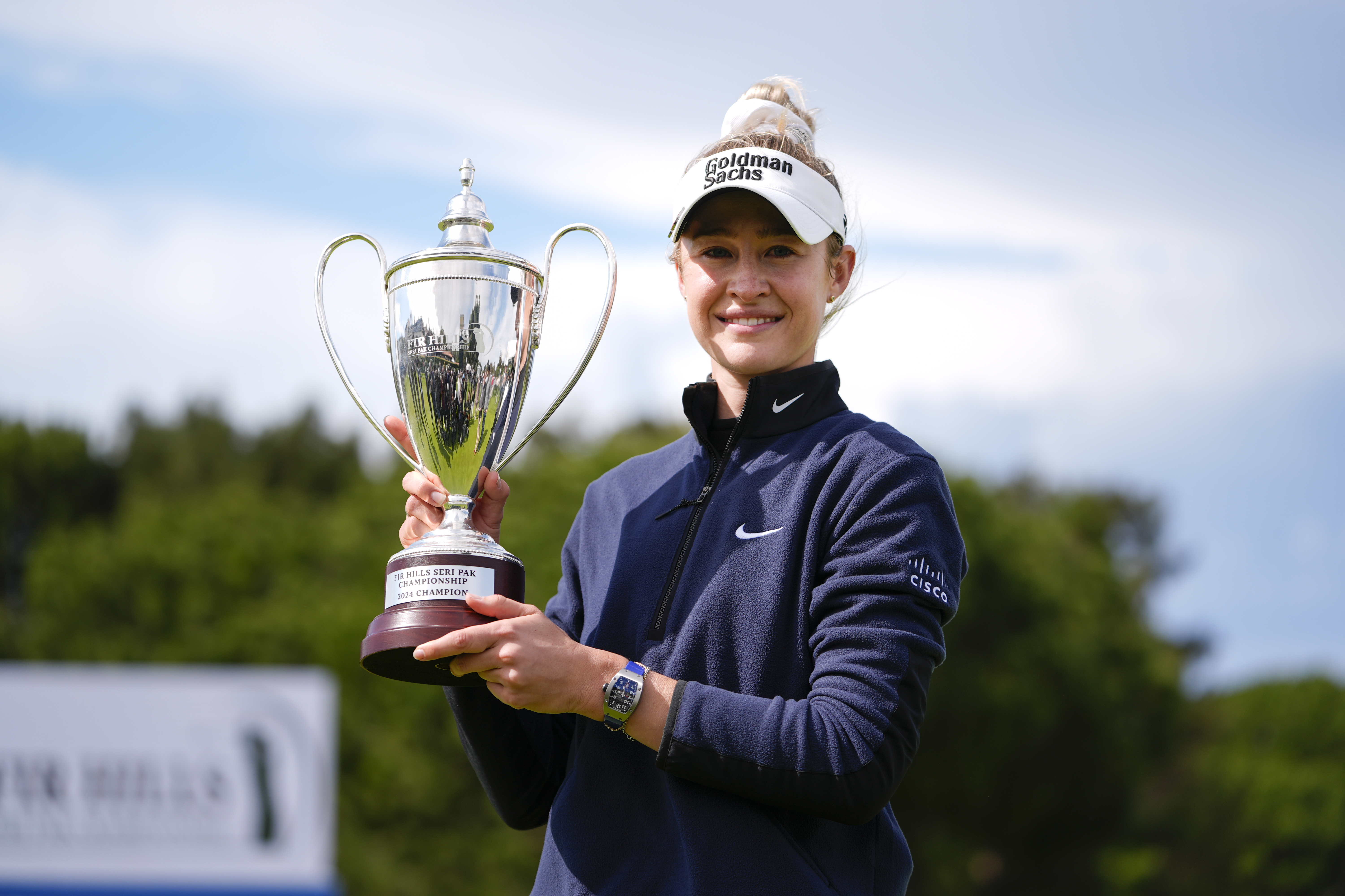 Nelly Korda holds up the trophy after winning the final round of LPGA's Fir Hills Seri Pak Championship golf tournament Sunday, March 24, 2024, in Palos Verdes Estates, Calif.