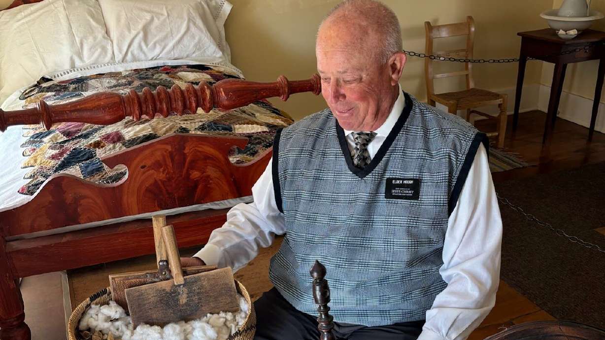 Stan Hough, a missionary at the Brigham Young Home in St. George, shows off cotton that was grown on site. Each year, a small garden is planted with cotton, hearkening back to the reason "Utah's Dixie" was settled in the 1860s.