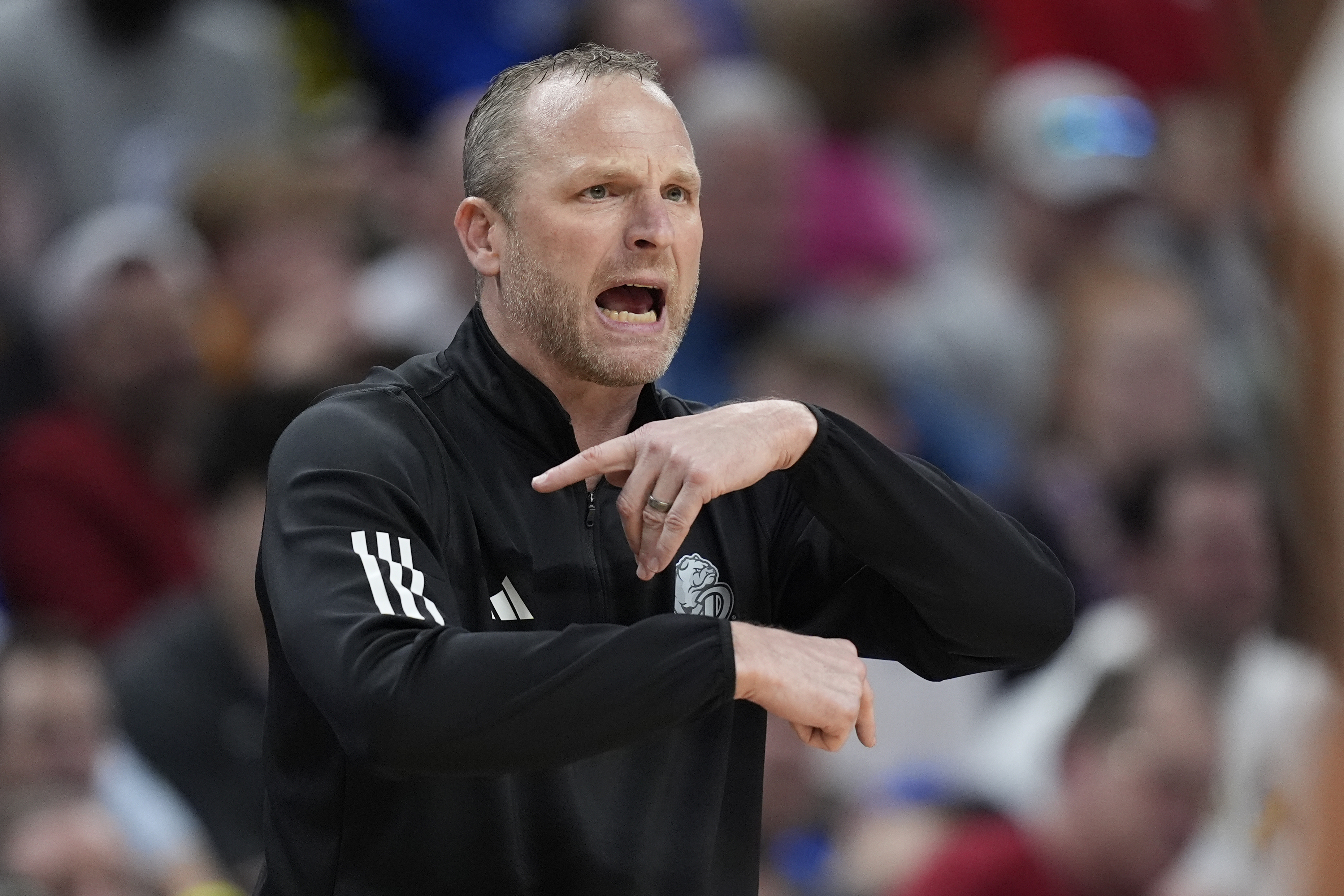 Drake head coach Darian DeVries is seen on the sidelines during the second half of a first-round college basketball game against Washington State in the NCAA Tournament Thursday, March 21, 2024, in Omaha, Neb.