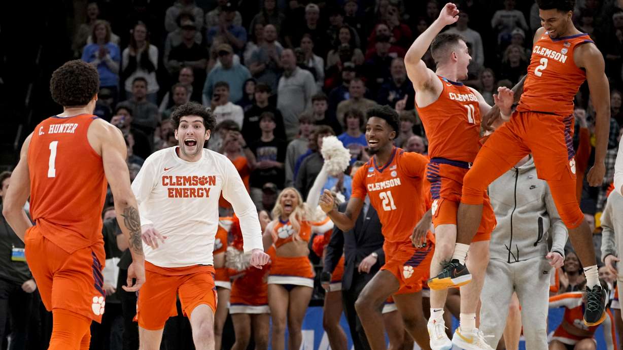 Clemson players celebrate the team's 72-64 win against Baylor after a second-round college basketball game in the NCAA Tournament, Sunday, March 24, 2024, in Memphis, Tenn.