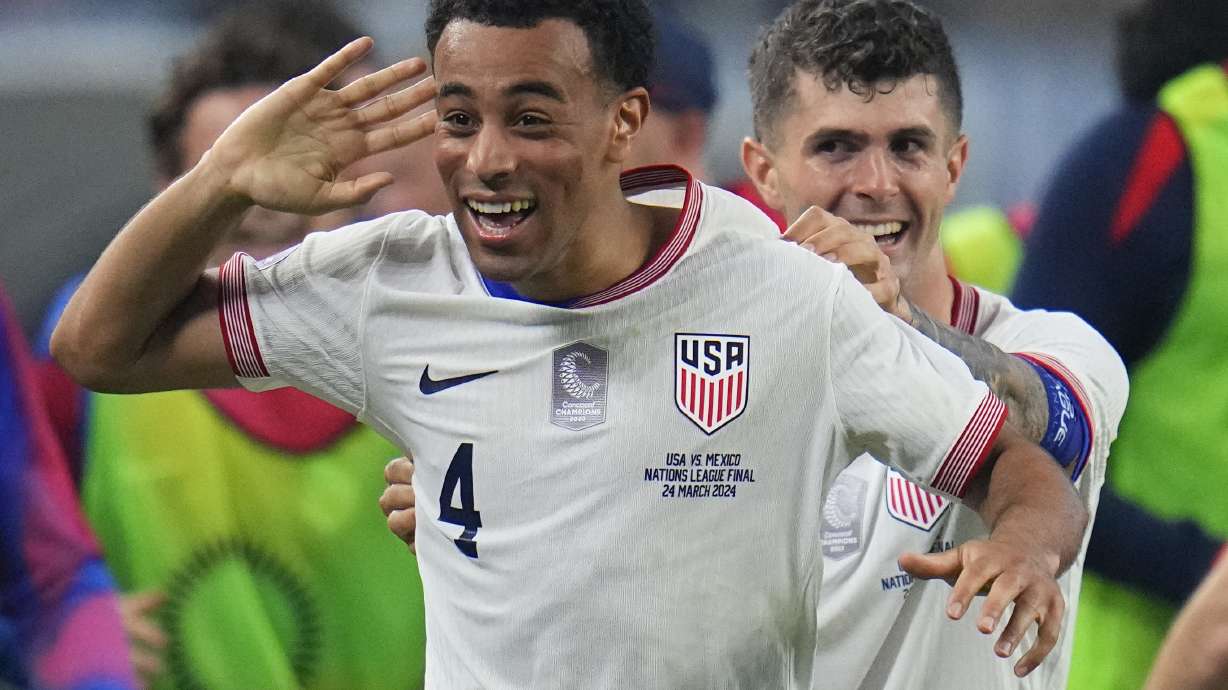 United States midfielder Tyler Adams (4) celebrates his goal with forward Christian Pulisic during the first half of a CONCACAF Nations League final soccer match against Mexico, Sunday, March 24, 2024, in Arlington, Texas.