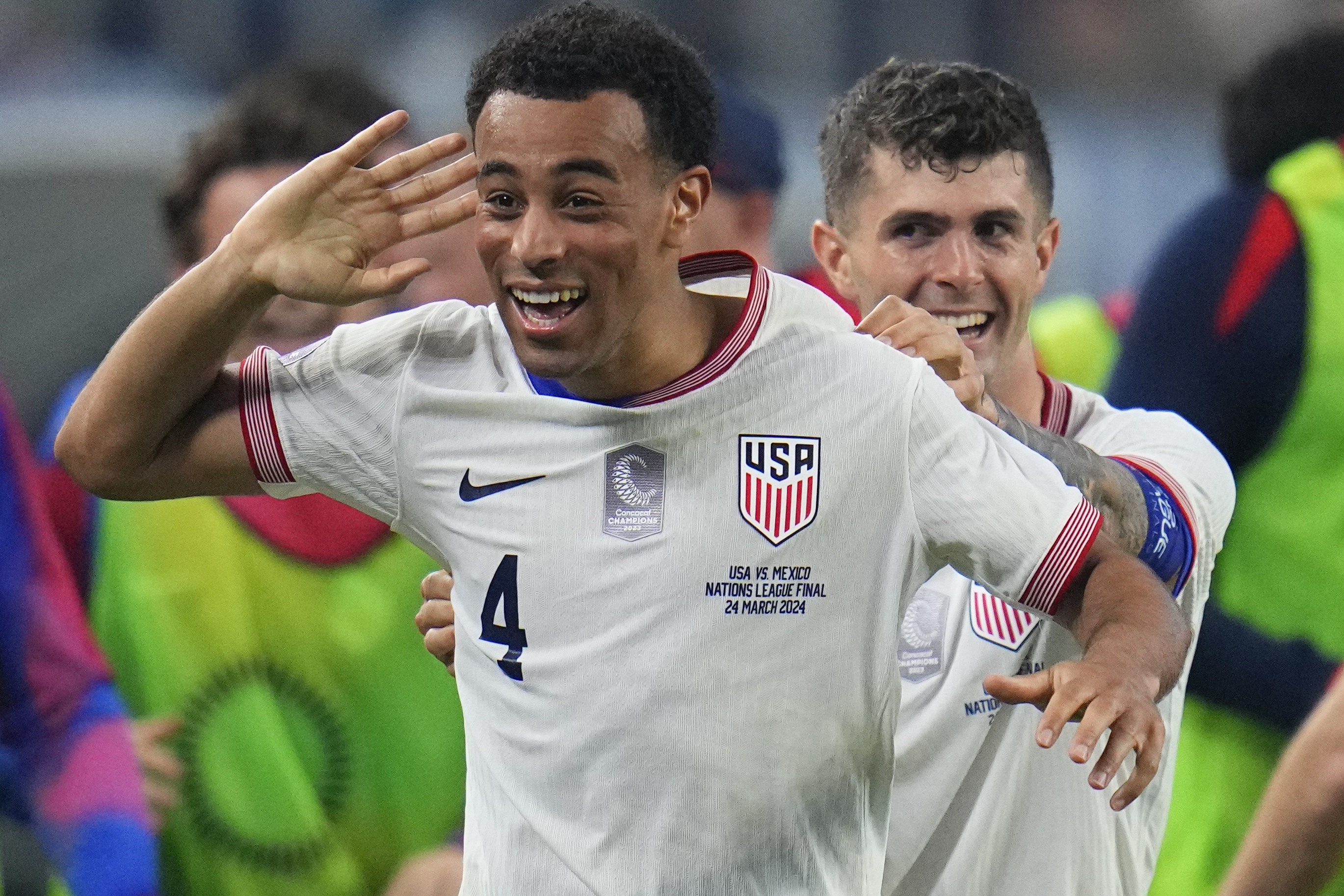 United States midfielder Tyler Adams (4) celebrates his goal with forward Christian Pulisic during the first half of a CONCACAF Nations League final soccer match against Mexico, Sunday, March 24, 2024, in Arlington, Texas.