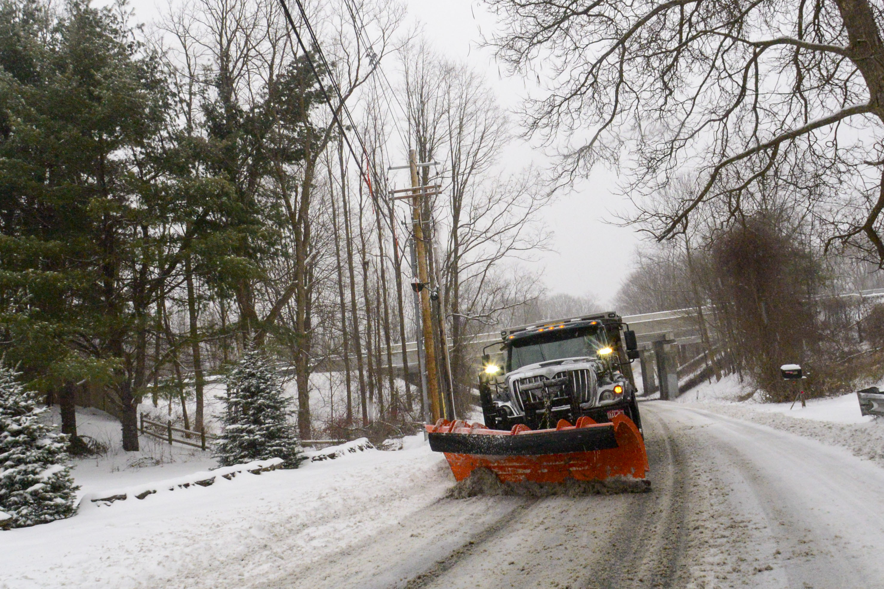 A snowplow on Maple Street in Brattleboro, Vt., Saturday. New England battled a mix of wind, rain, sleet and heavy snow across the region Saturday with more than a foot of snow expected in ski county, but mostly rain, wind and possible flooding in southern areas and along the coast.