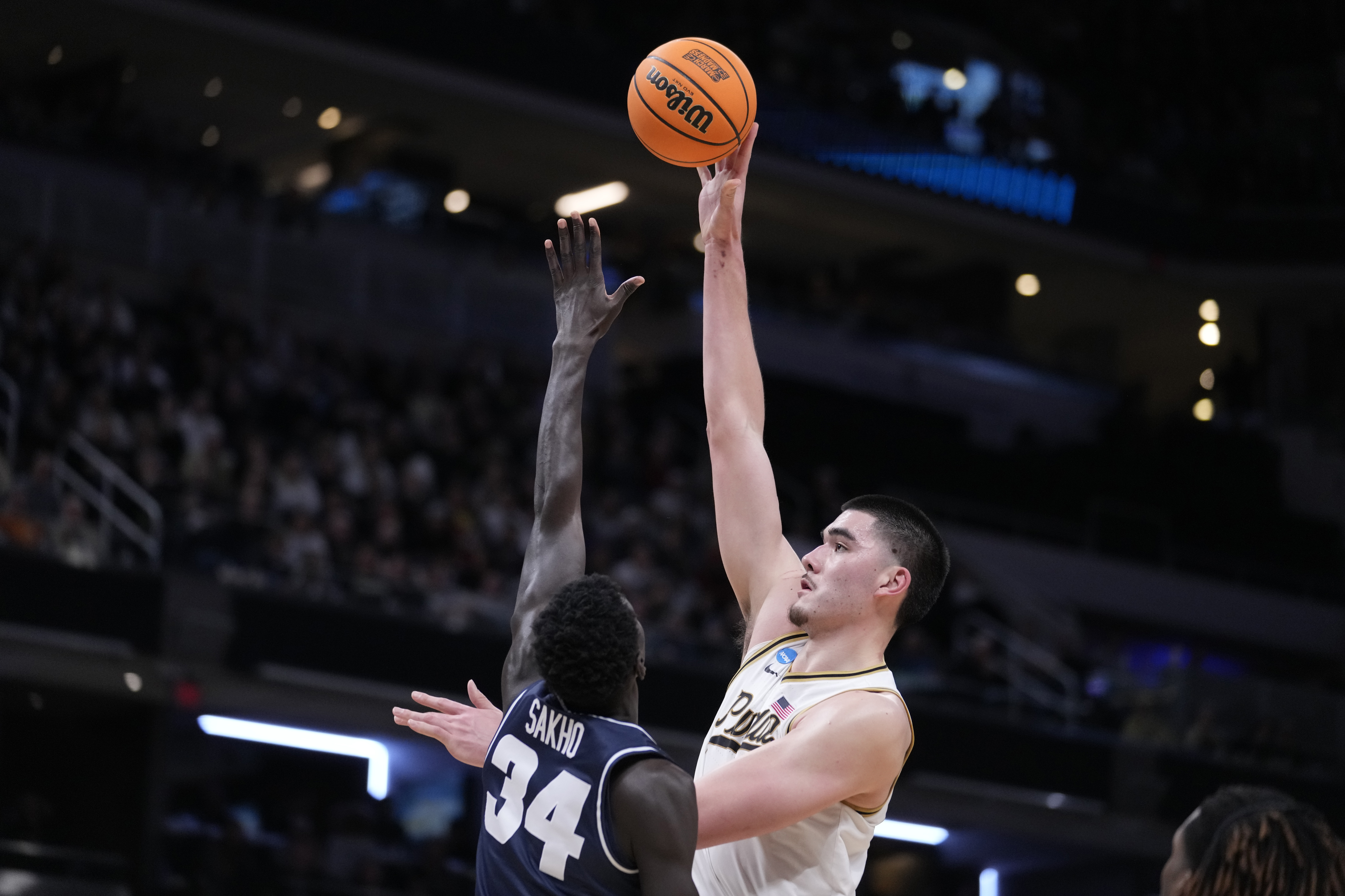 Purdue's Zach Edey shoots over Utah State's Kalifa Sakho (34) during the second half of a second-round college basketball game in the NCAA Tournament, Sunday, March 24, 2024 in Indianapolis. 